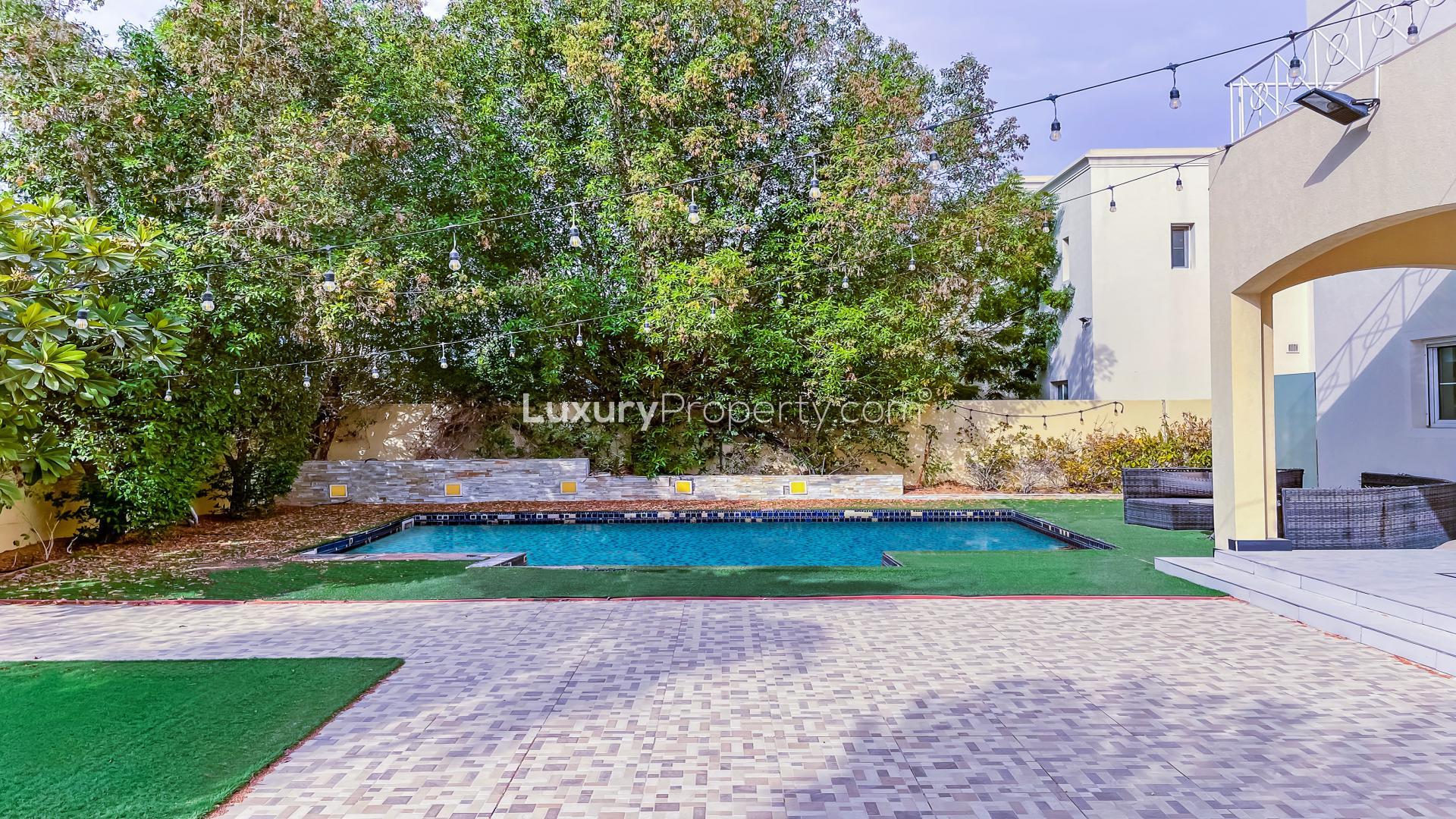 N/A,Bright living space in Meadows 1 villa with large windows and modern decor.