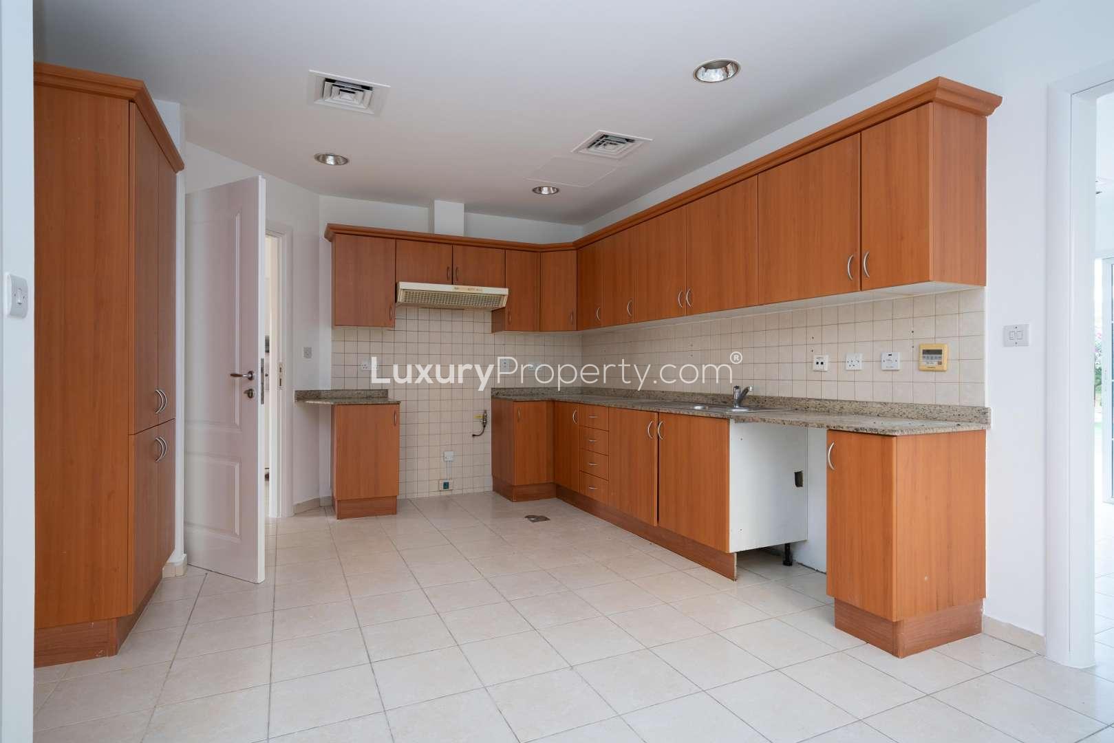 Spacious villa interior with tiled floors and modern kitchen in Meadows 1, Emirates Living