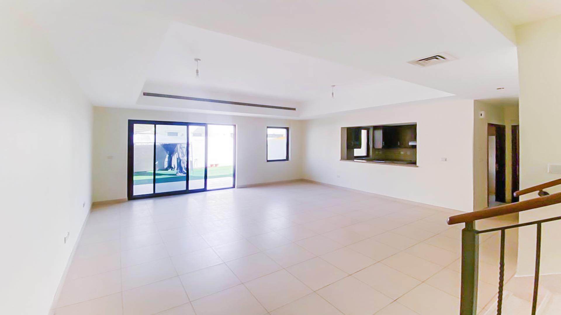 Spacious villa backyard with green lawn and canopy in Mira, Reem community for rent