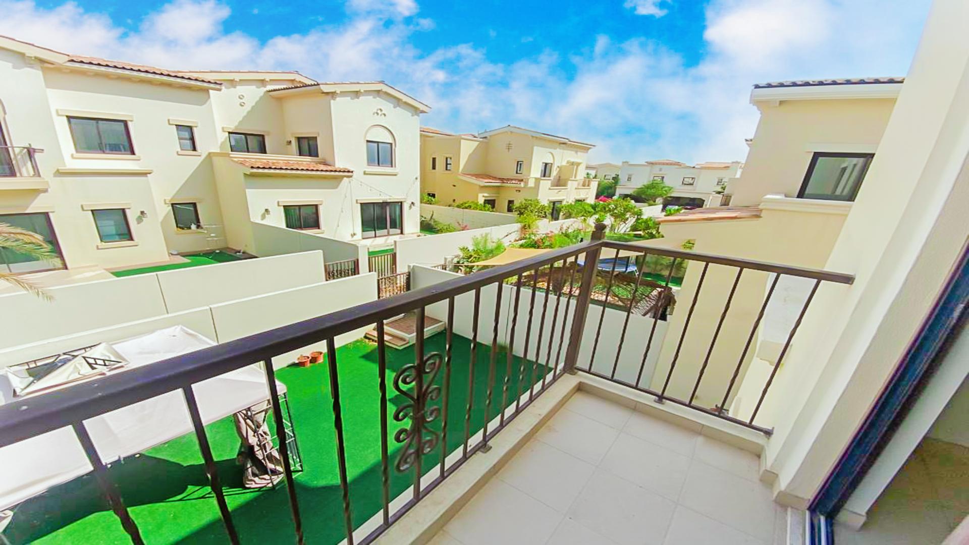 Spacious living area in Mira villa, open layout with large windows and tiled floors