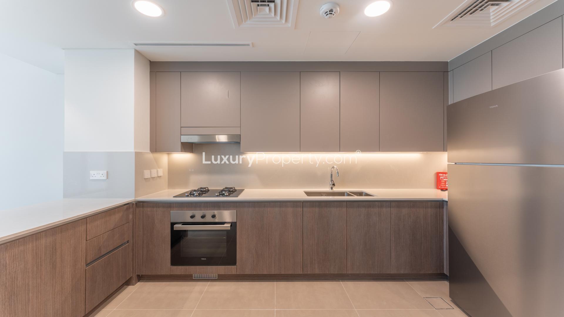 Modern kitchen and living area in 3-bedroom villa, Elan, Tilal Al Ghaf rental