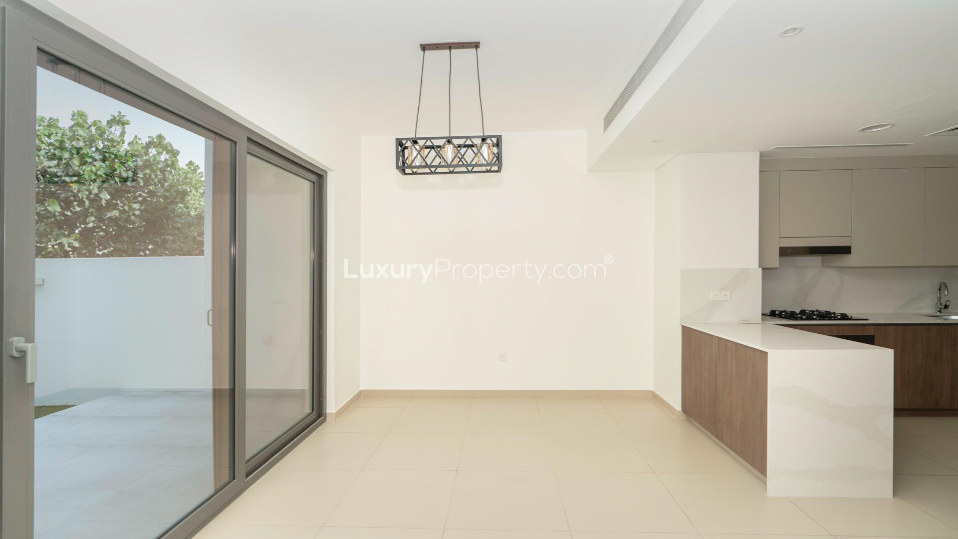 Modern kitchen in 3-bedroom villa, Elan, Tilal Al Ghaf, with sleek cabinets and appliances