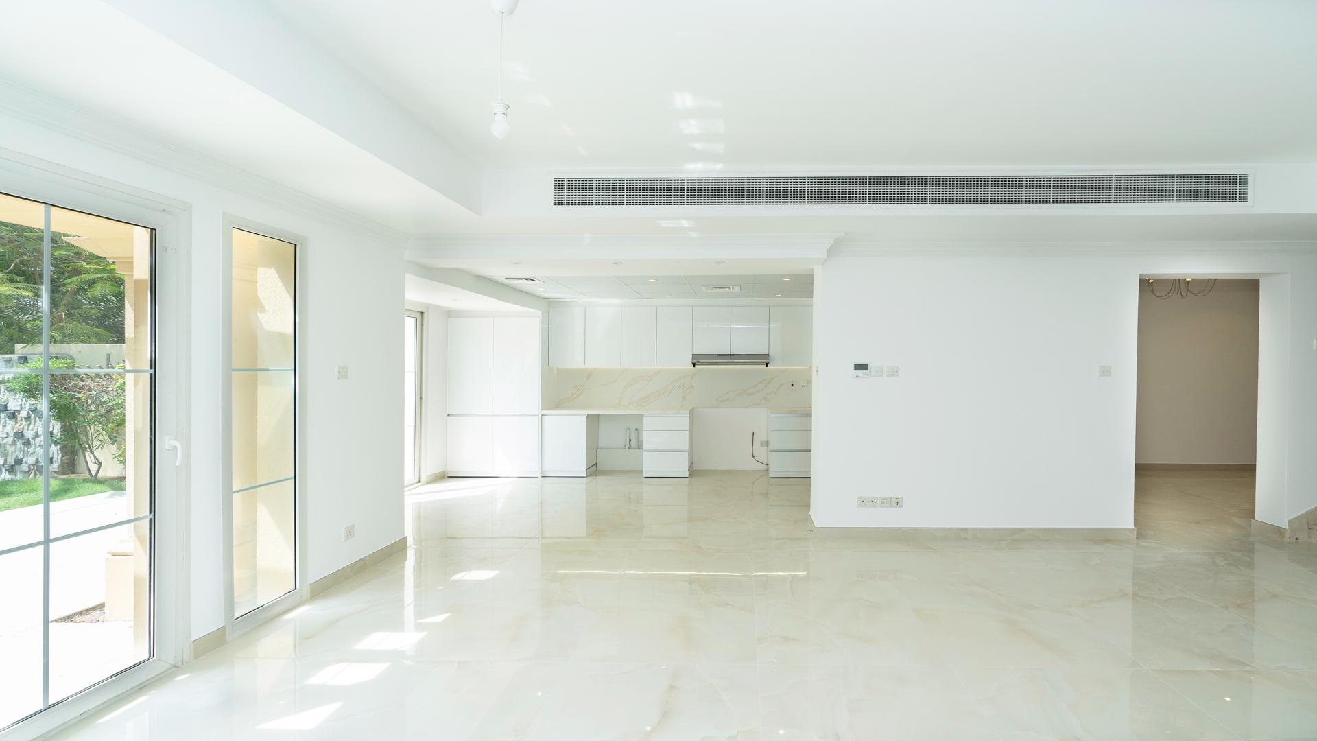 Upgraded 3-bedroom villa balcony with lush garden view in Springs 12, Dubai