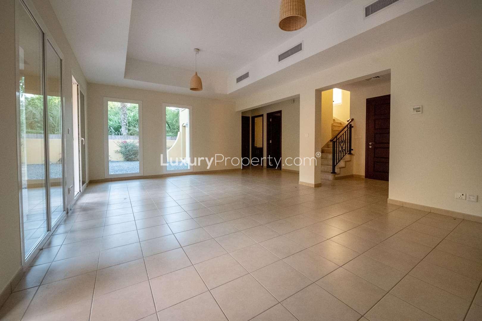 Spacious living room in 3-bedroom villa, Palmera 4, Arabian Ranches, with large windows