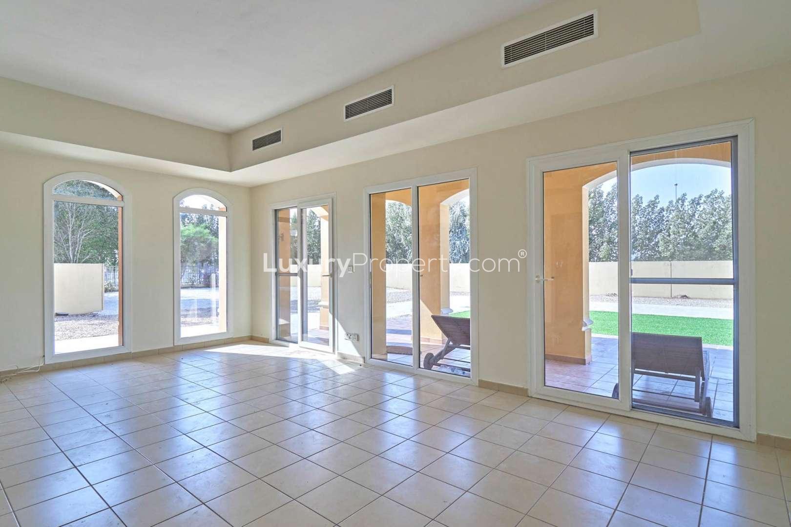 "Interior view of bathroom and hallway in Palmera Type A villa, Arabian Ranches.",Bright living room in Type A Villa, Palmera, Arabian Ranches with garden view