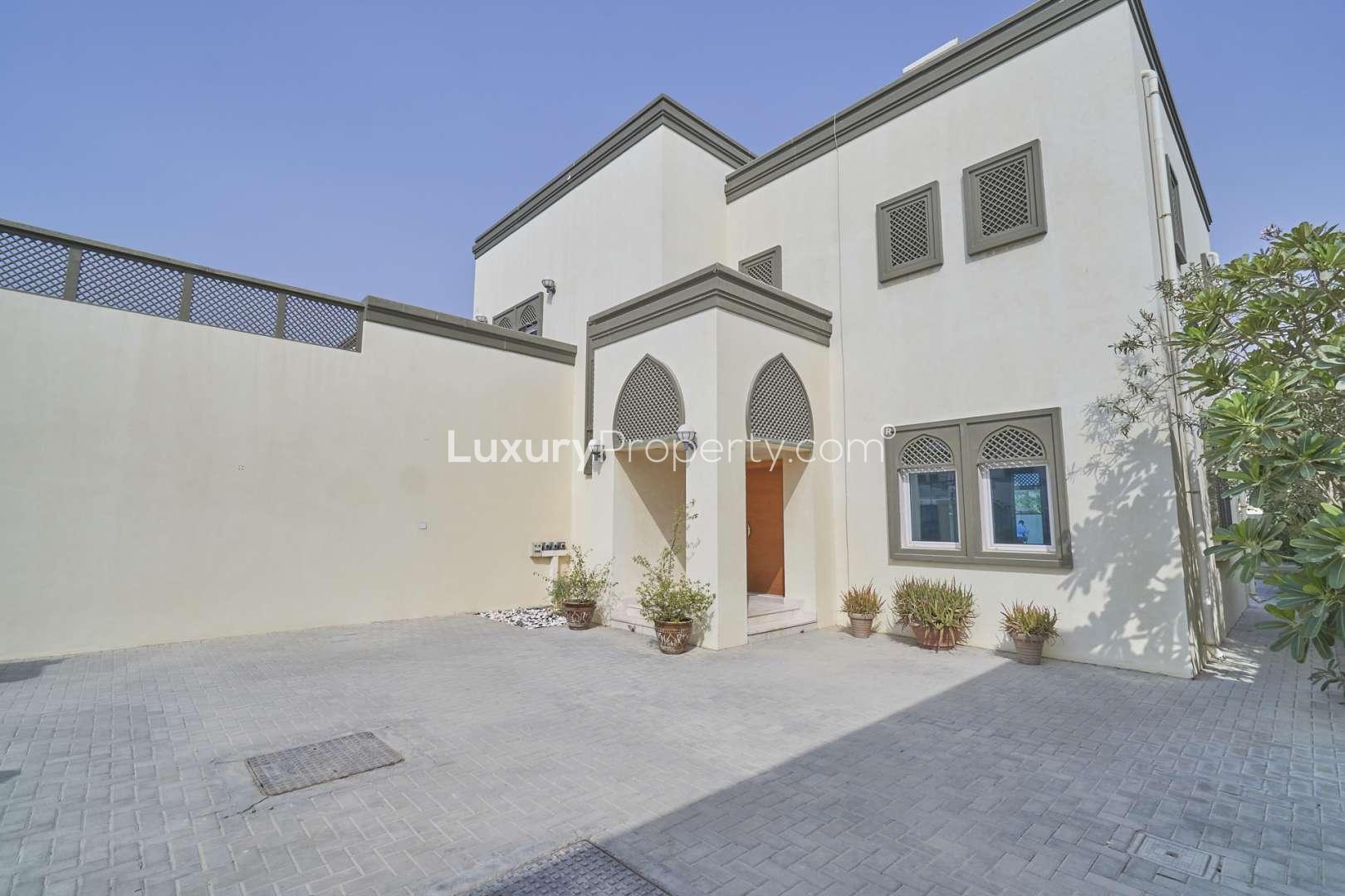 Modern kitchen with wooden cabinets in Jumeirah Park 3-bedroom villa for rent