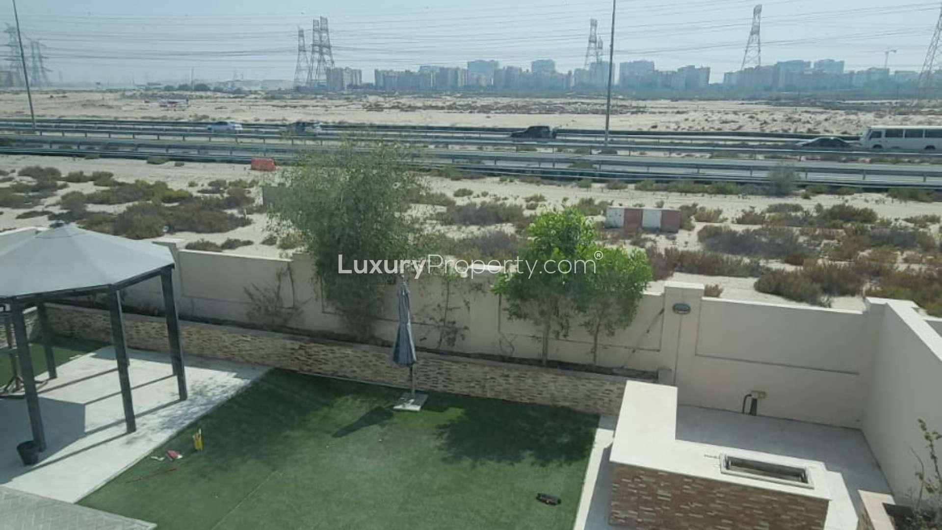 Bright living area in cozy 3-bedroom villa, Jumeirah Park Regional, with garden access