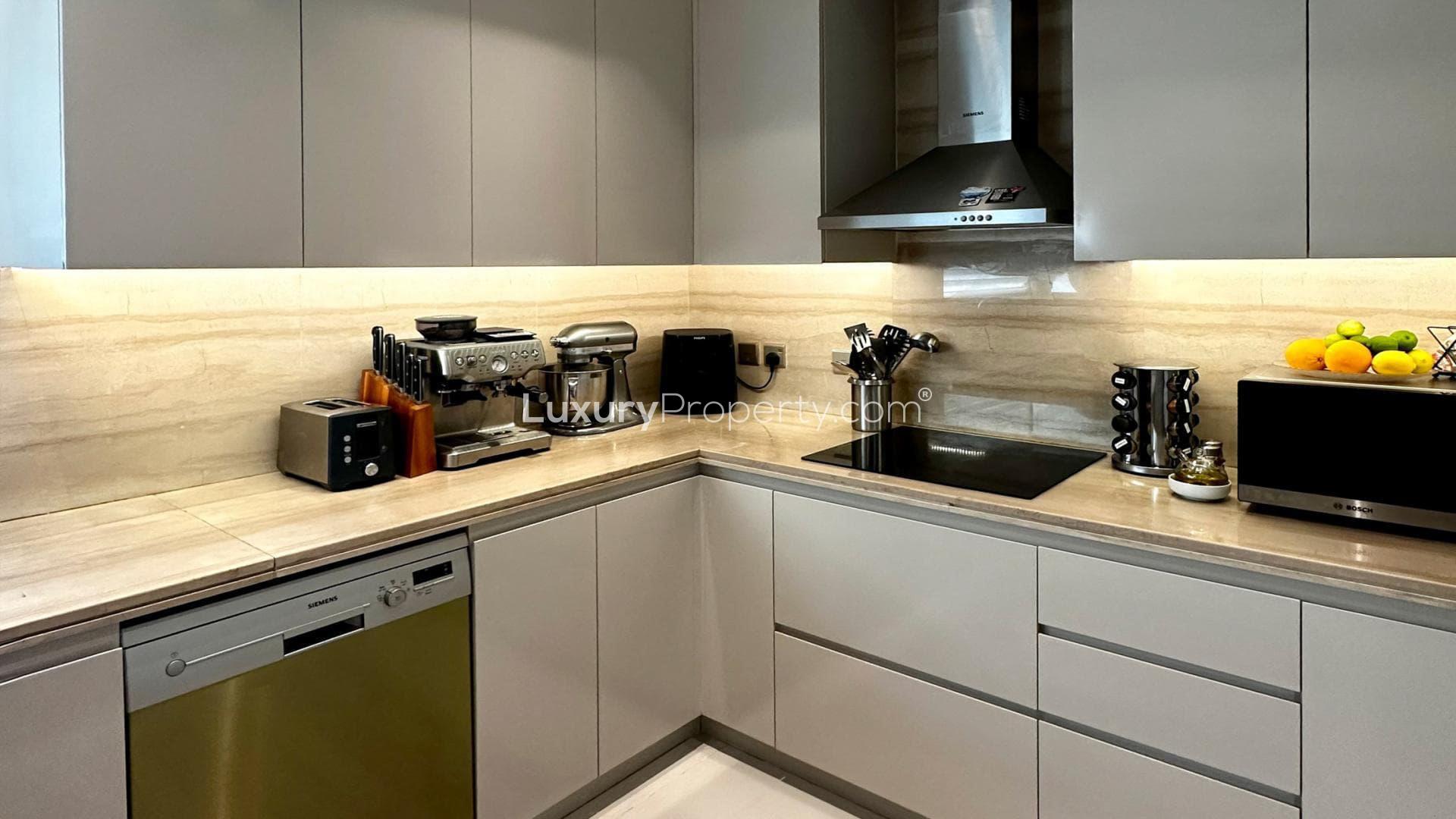 Balcony view from Trevi villa in Damac Hills, featuring modern design and greenery