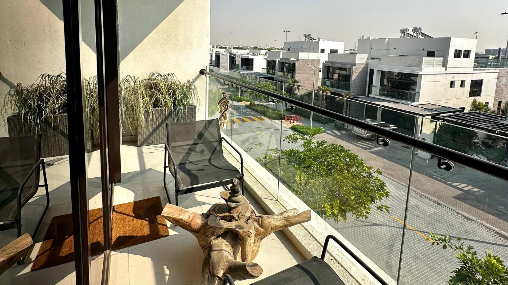 Modern villa living room with artwork, wooden furniture in Damac Hills Trevi community