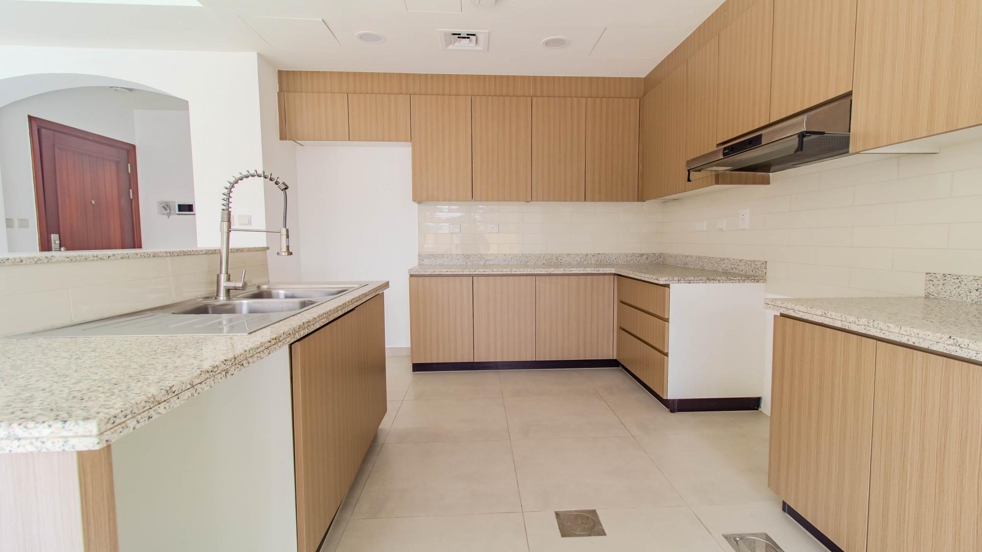 Spacious kitchen and living area in Amaranta villa, Dubai Land, Villanova for rent