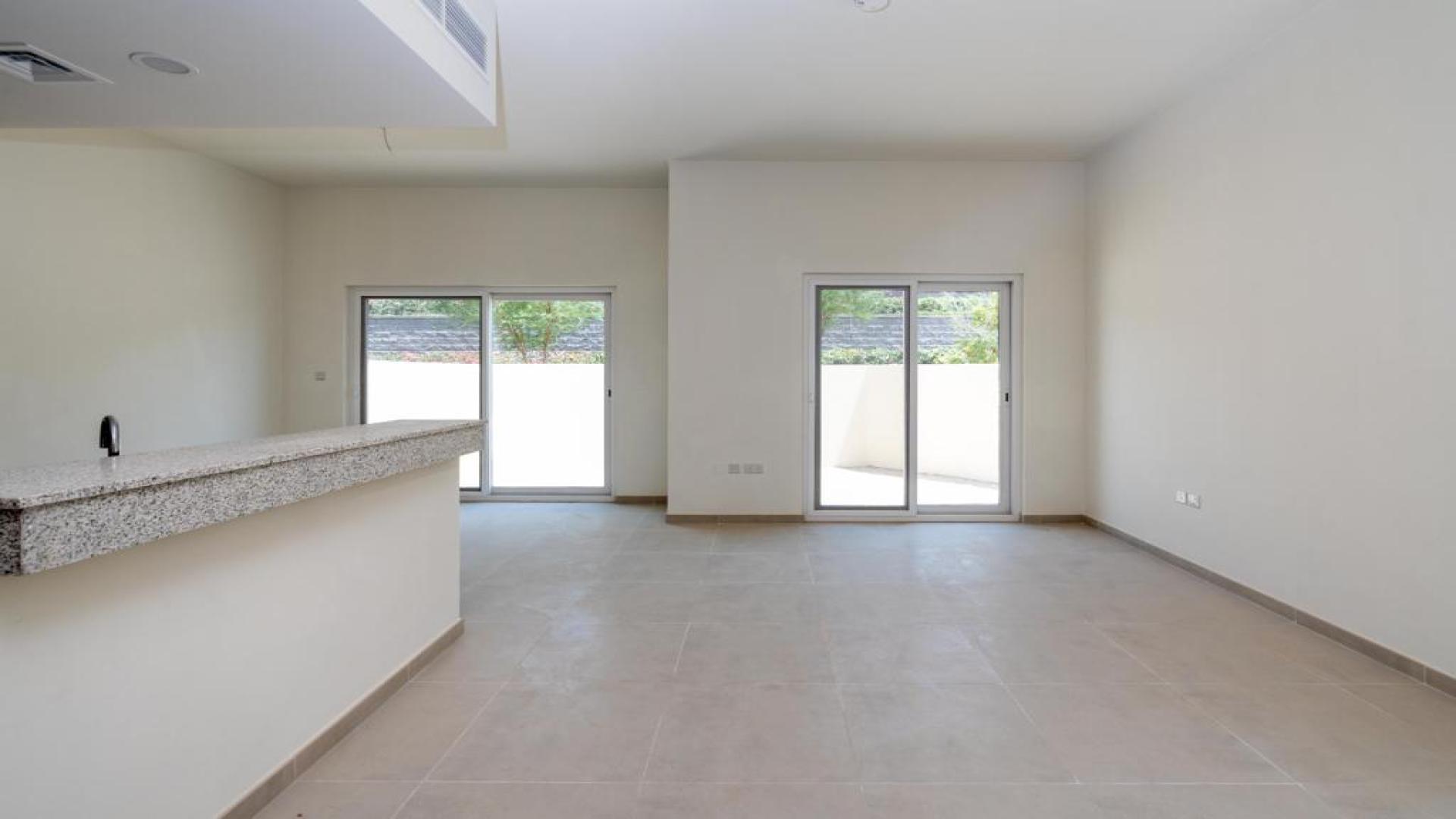 Modern kitchen in Amaranta villa for rent, Villanova, featuring sleek countertops and wood cabinets