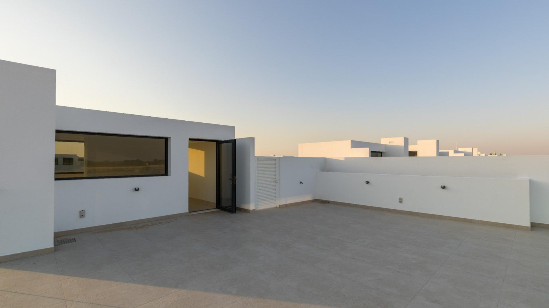 "Spacious rooftop terrace of 3-bedroom villa in Dubai Hills Estate, Golf Grove community.",Modern kitchen in spacious Dubai Hills Estate villa, Golf Grove community, available for rent