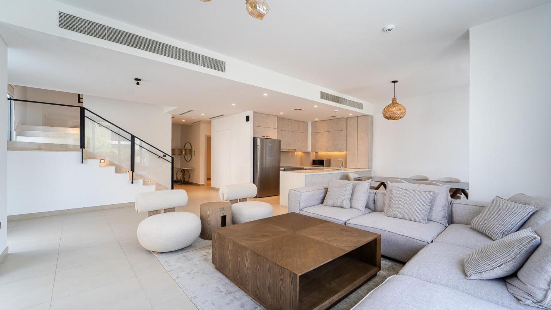 Modern kitchen in furnished Golf Grove Villa, Dubai Hills, featuring sleek appliances and cabinetry