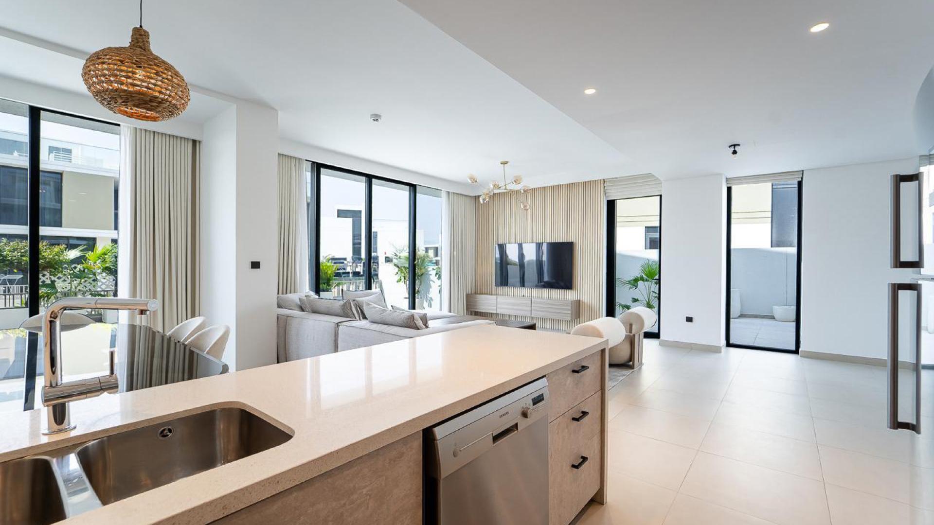 Furnished living room in Golf Grove Villa with pool view, Dubai Hills Estate