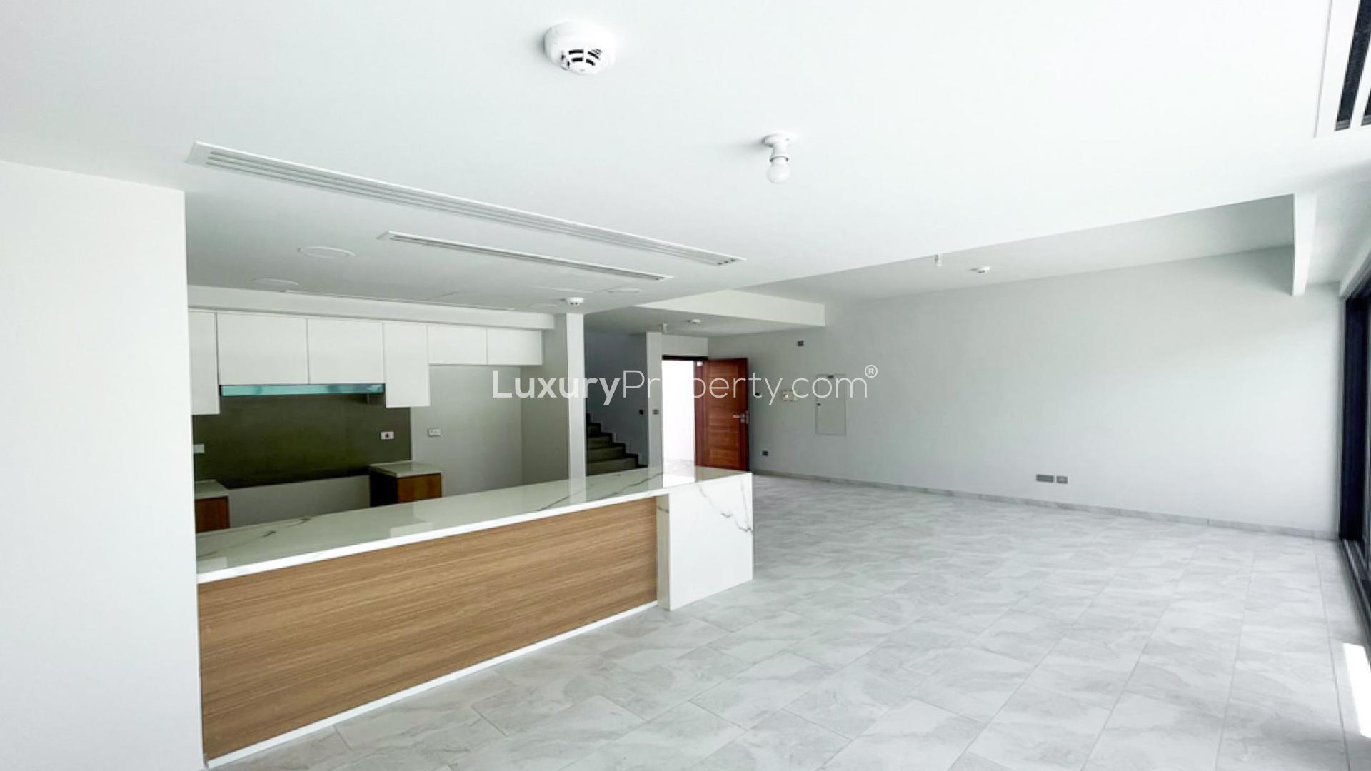 Brand new villa interior with open kitchen and staircase in La Rosa 5, Dubai Land