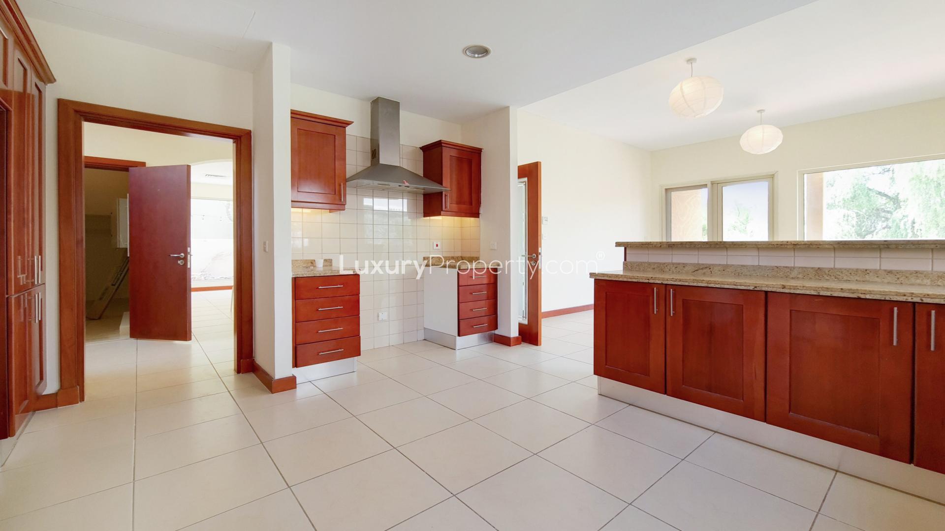 "Spacious balcony with park view in Saheel villa, Arabian Ranches, for rent.",Spacious kitchen in Saheel villa, Arabian Ranches, with modern cabinetry and ample natural light