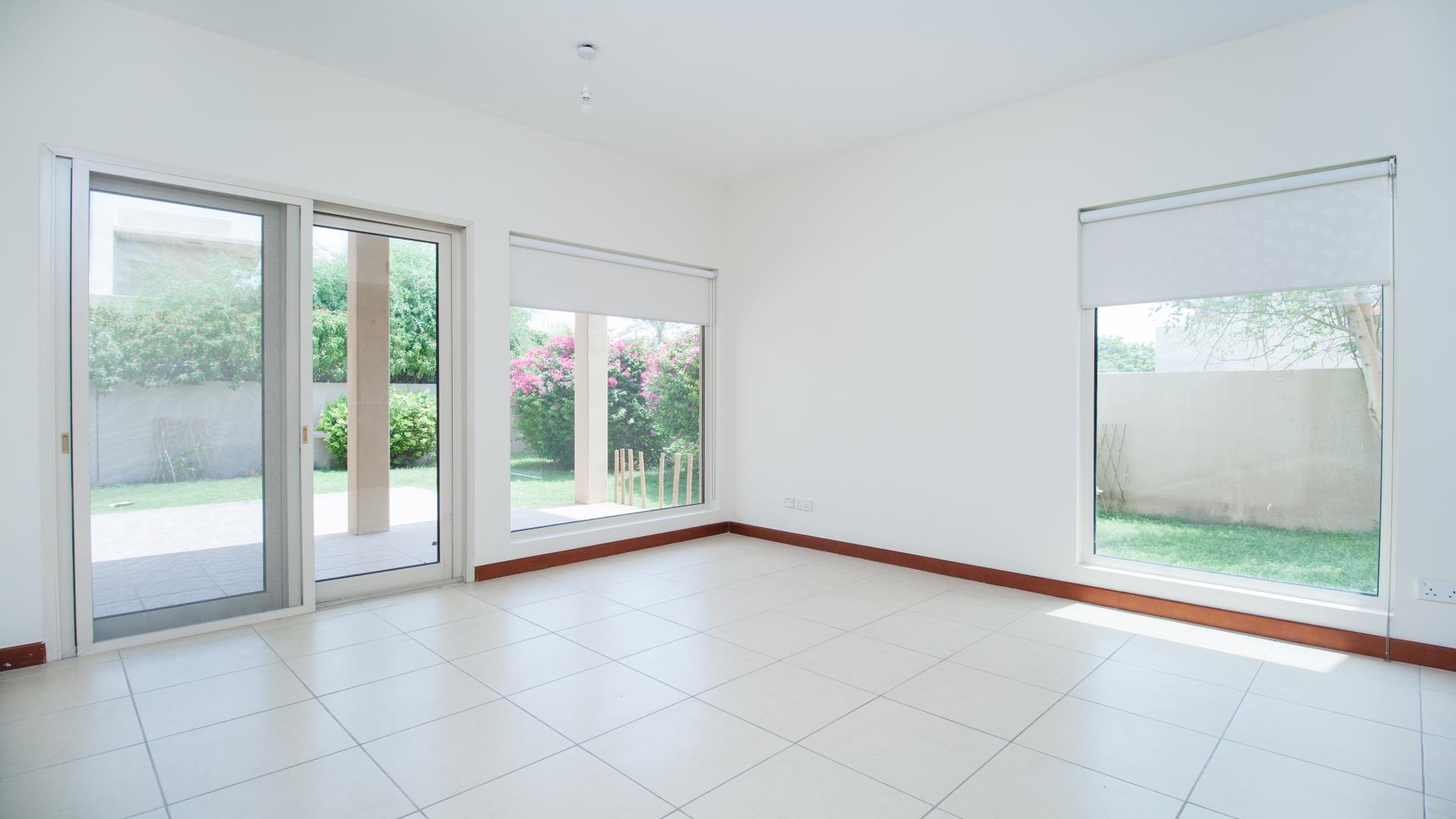 Beautiful villa exterior with lush greenery in Saheel, Arabian Ranches, available for rent