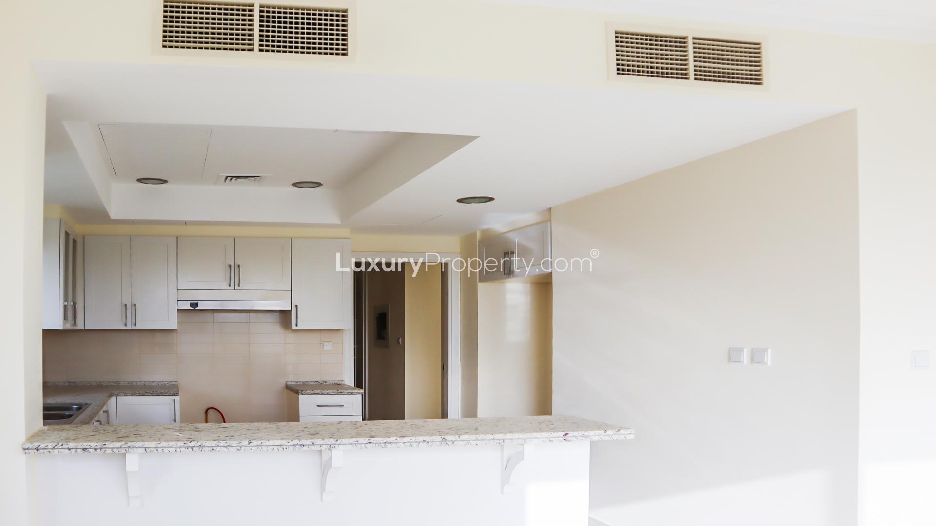 "Bright living area with large windows in Samara villa, Arabian Ranches 2 for rent.",Modern kitchen with granite countertops in Arabian Ranches 2, Samara villa for rent