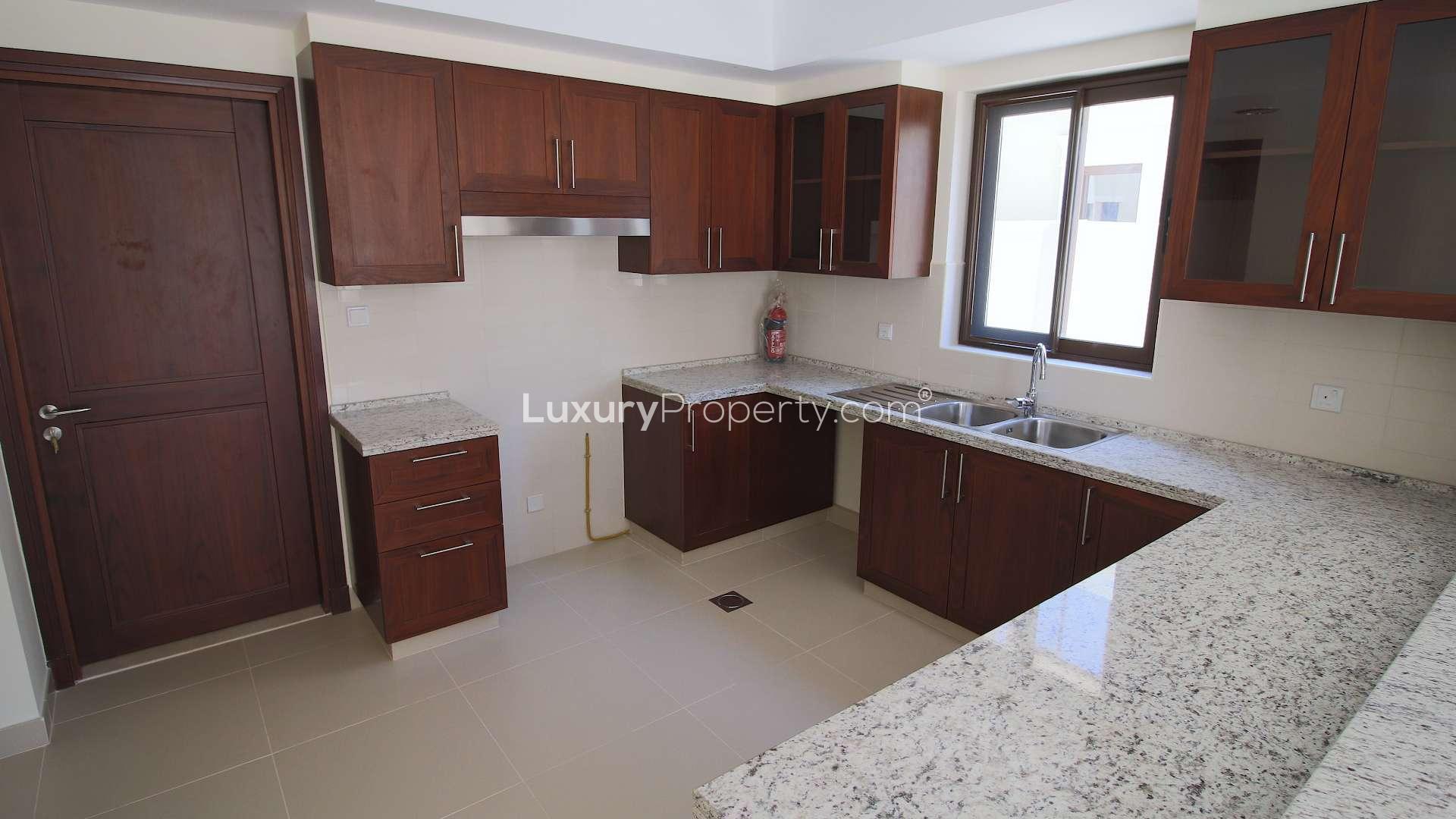 Modern kitchen with granite countertops in Samara villa, Arabian Ranches 2, available for rent