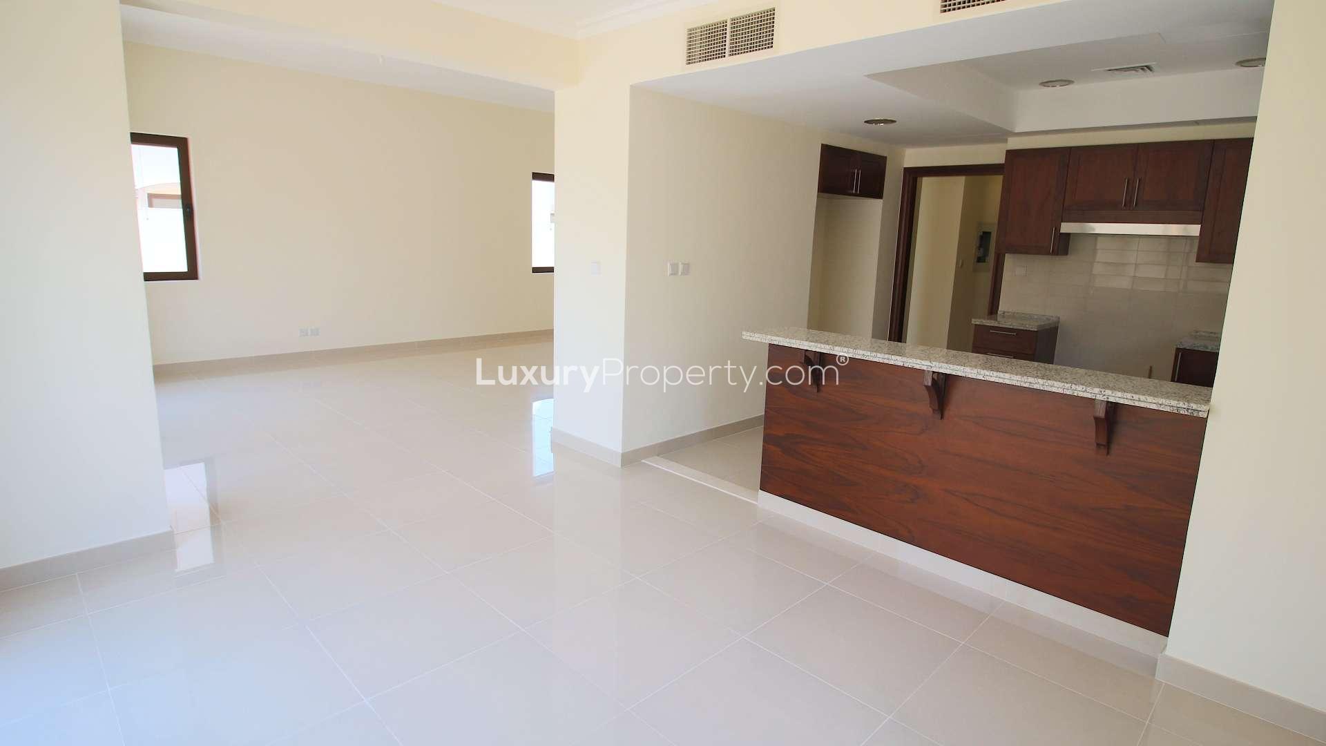 "Spacious living area in three-bedroom villa, Samara, Arabian Ranches 2, available for rent.",Modern kitchen and living area in three-bedroom villa, Arabian Ranches 2, Samara, for rent
