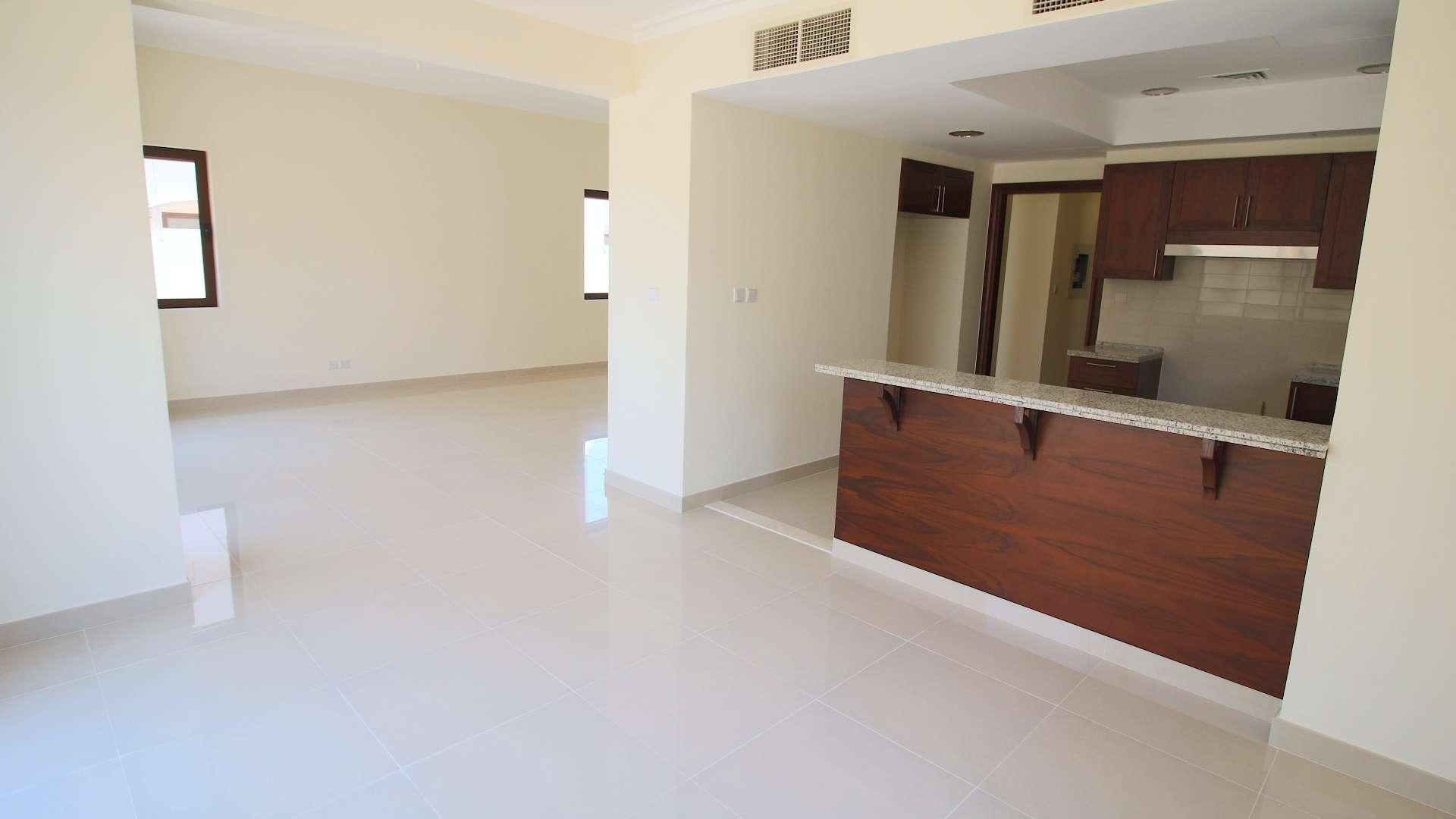 "Spacious living area in three-bedroom villa, Samara, Arabian Ranches 2, available for rent.",Modern kitchen and living area in three-bedroom villa, Arabian Ranches 2, Samara, for rent