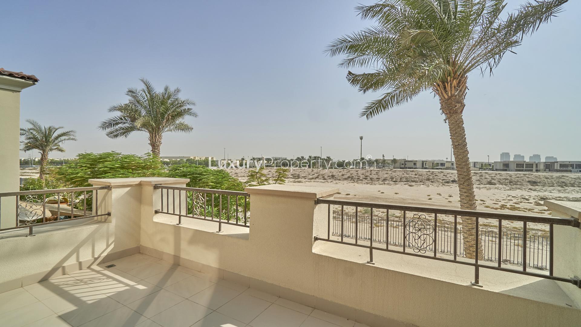 Spacious living room with large windows in Arabian Ranches II villa for rent