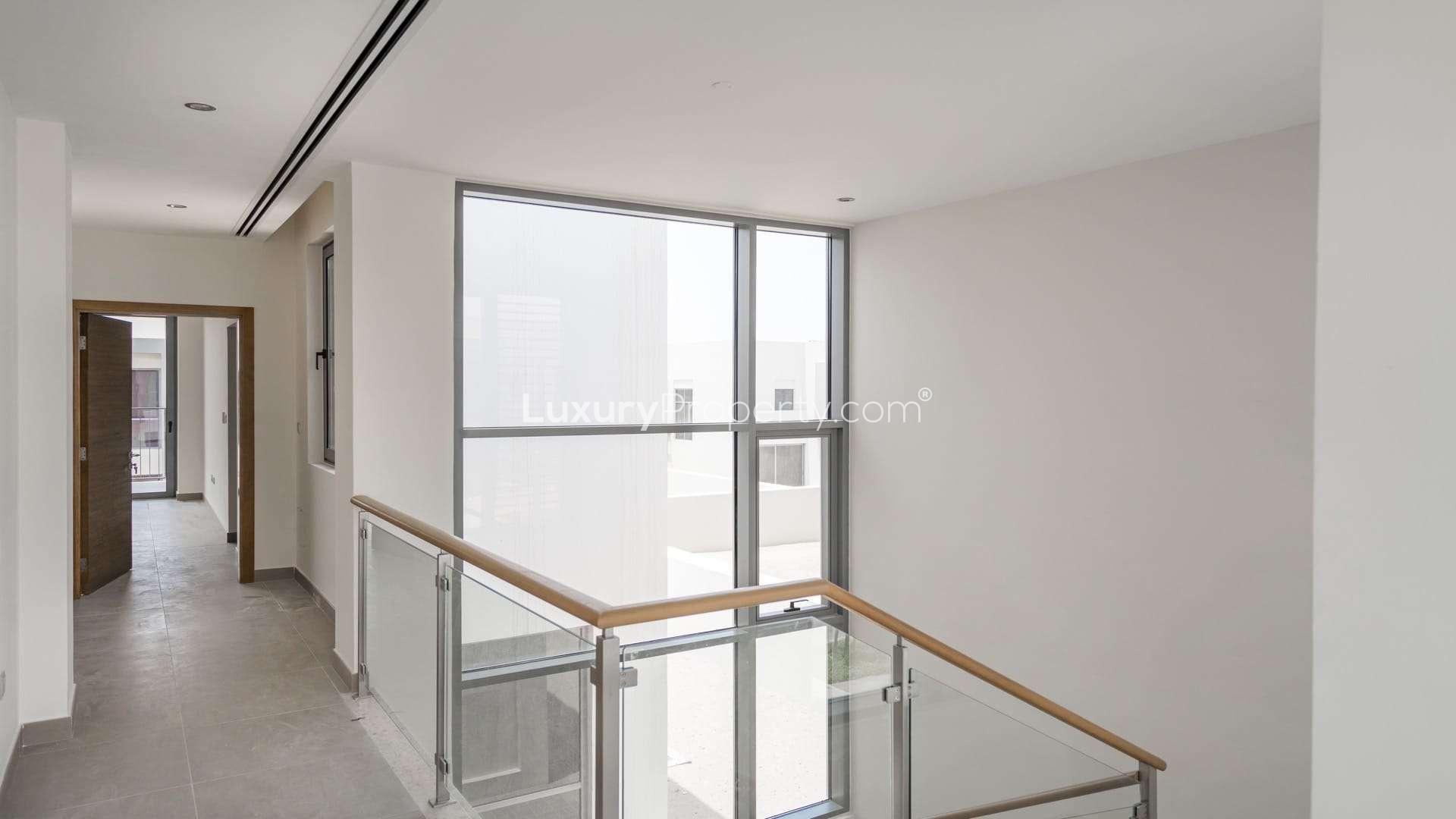 Modern bedroom in 3-bedroom villa, Sidra, Dubai Hills Estate with balcony view