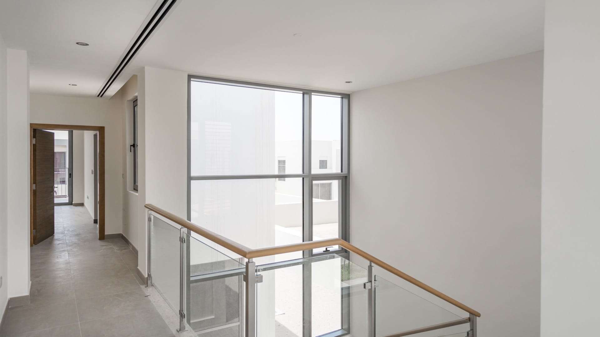 Modern bedroom in 3-bedroom villa, Sidra, Dubai Hills Estate with balcony view