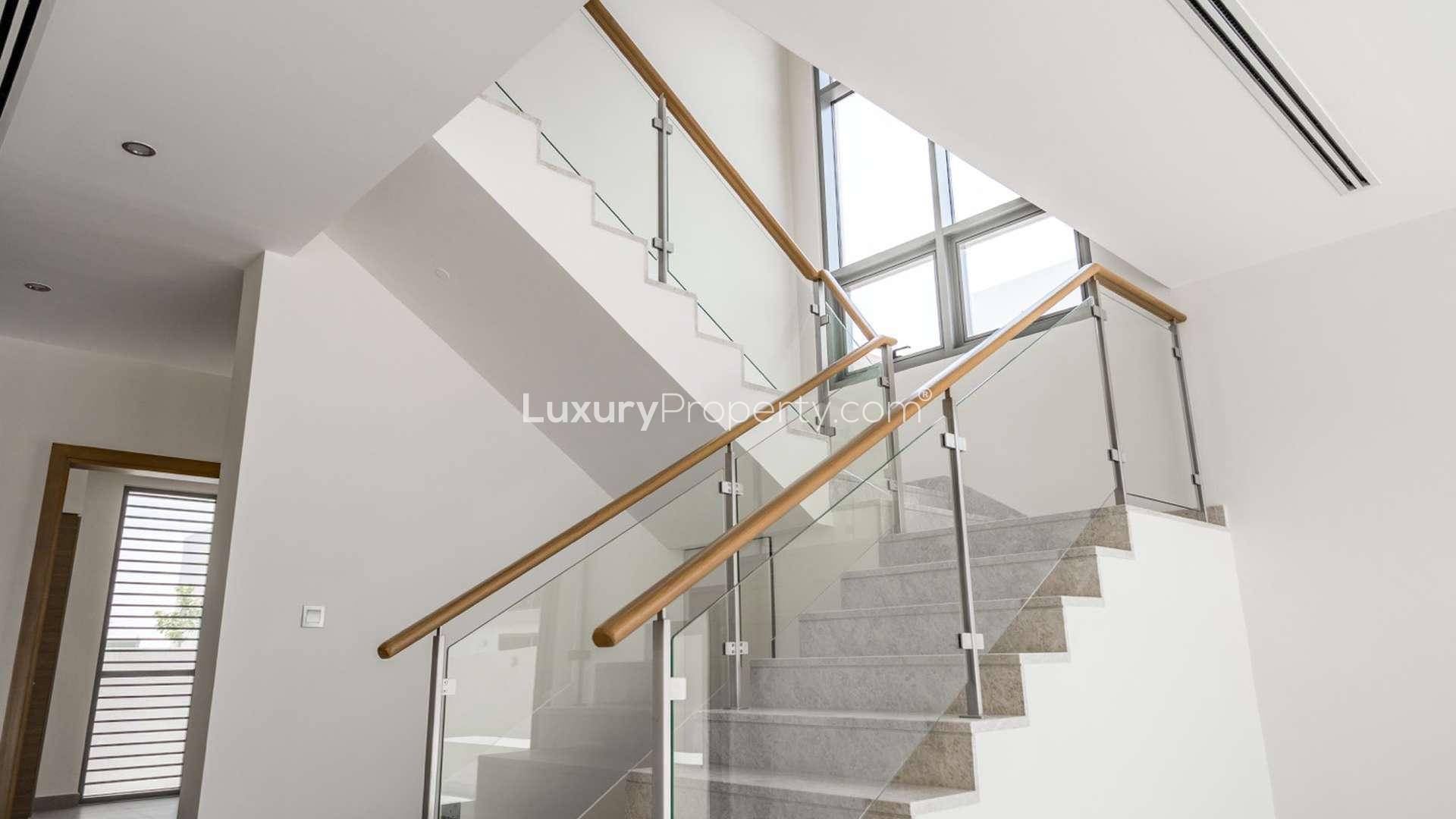 Modern kitchen and staircase in 3-bedroom villa, Sidra Villas, Dubai Hills Estate for rent