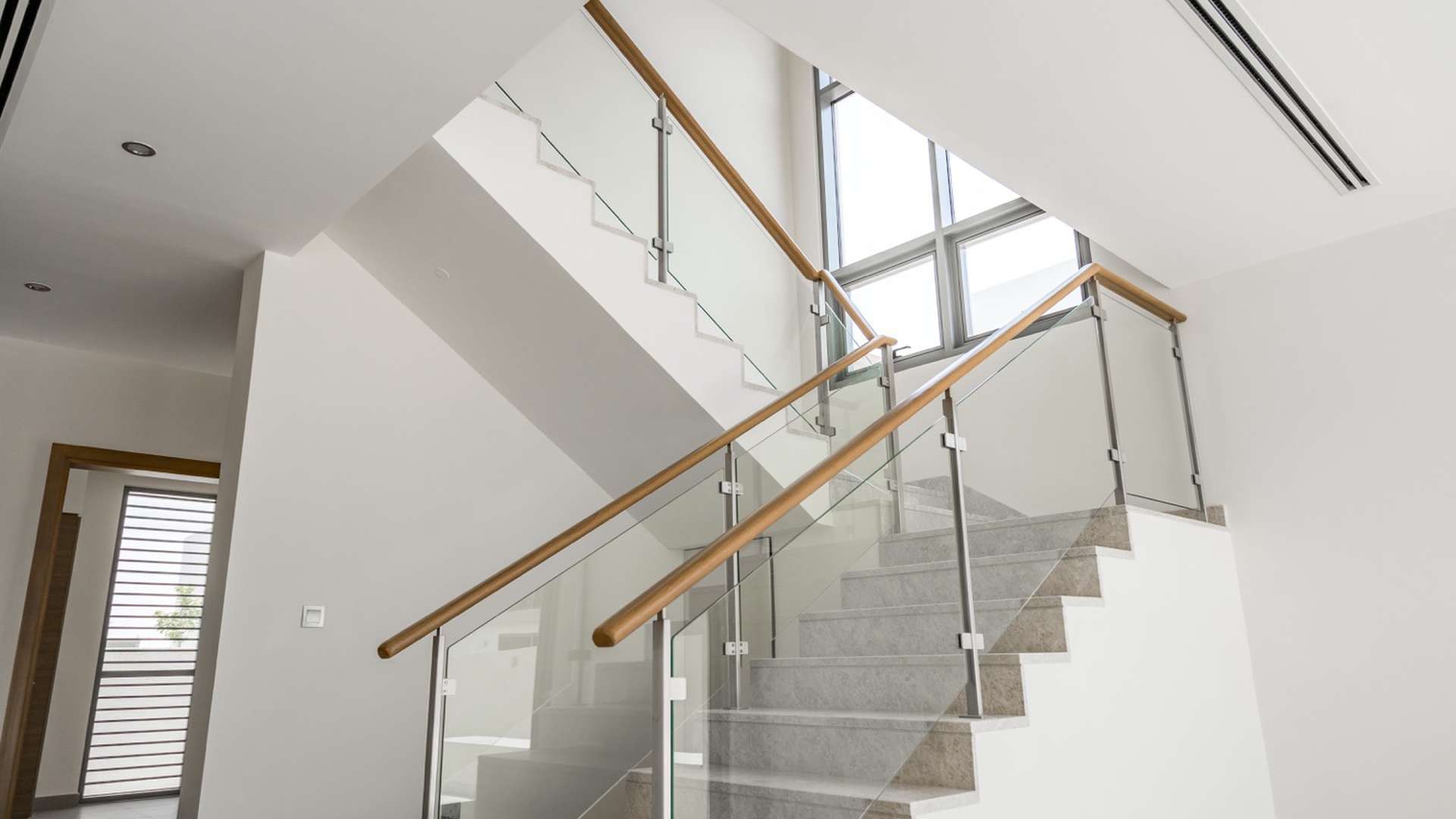 Modern kitchen and staircase in 3-bedroom villa, Sidra Villas, Dubai Hills Estate for rent