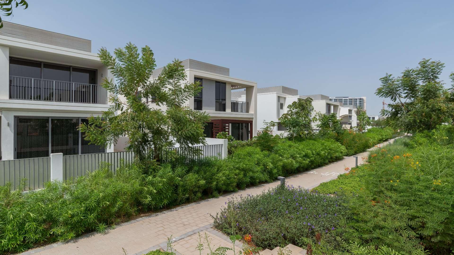 "Spacious balcony view from three-bedroom villa in Sidra, Dubai Hills Estate for rent.",Exterior view of Sidra Villas, Dubai Hills Estate with lush greenery and modern architecture