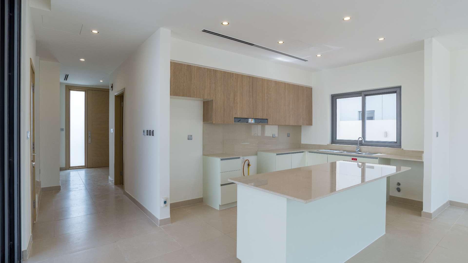 "Modern 3-bedroom villa exterior with landscaped garden in Sidra Villas, Dubai Hills Estate.",Modern kitchen in spacious Sidra Villas home, Dubai Hills Estate, available for rent