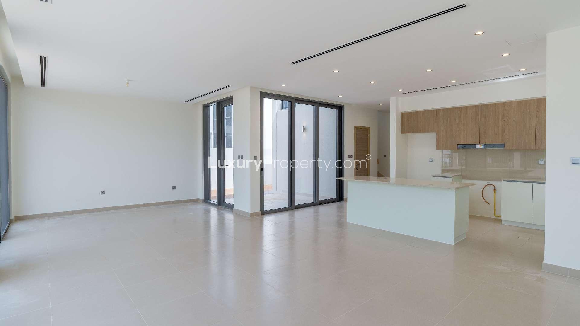 Modern open-plan kitchen and living area in Sidra Villas, Dubai Hills Estate