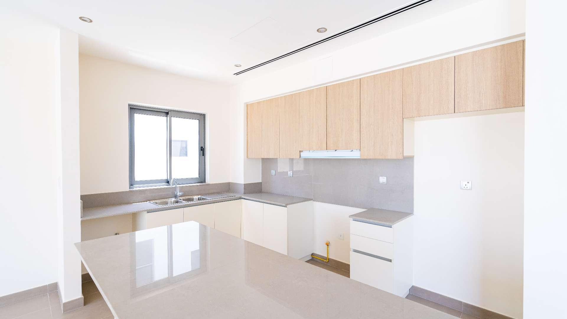 Bright living room in three-bedroom villa, Sidra, Dubai Hills Estate, with large windows