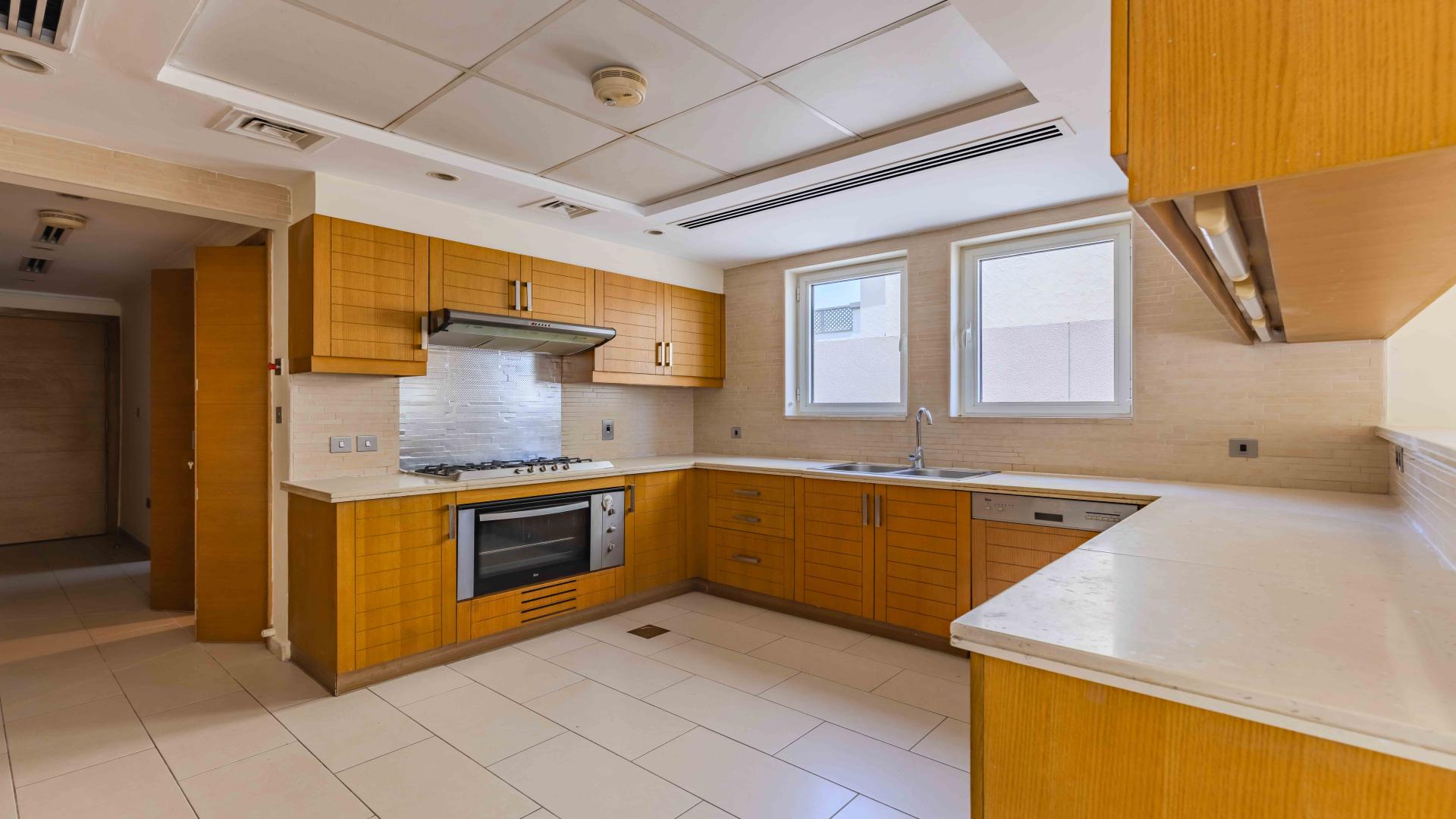 Bright living room with large windows in Jumeirah Park villa for rent