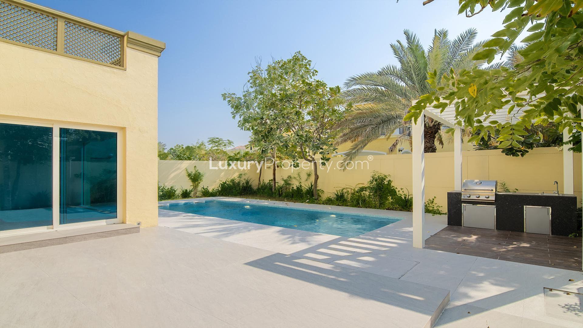 Modern open-plan living area in Casa Milano Style villa, Jumeirah Park, with large windows