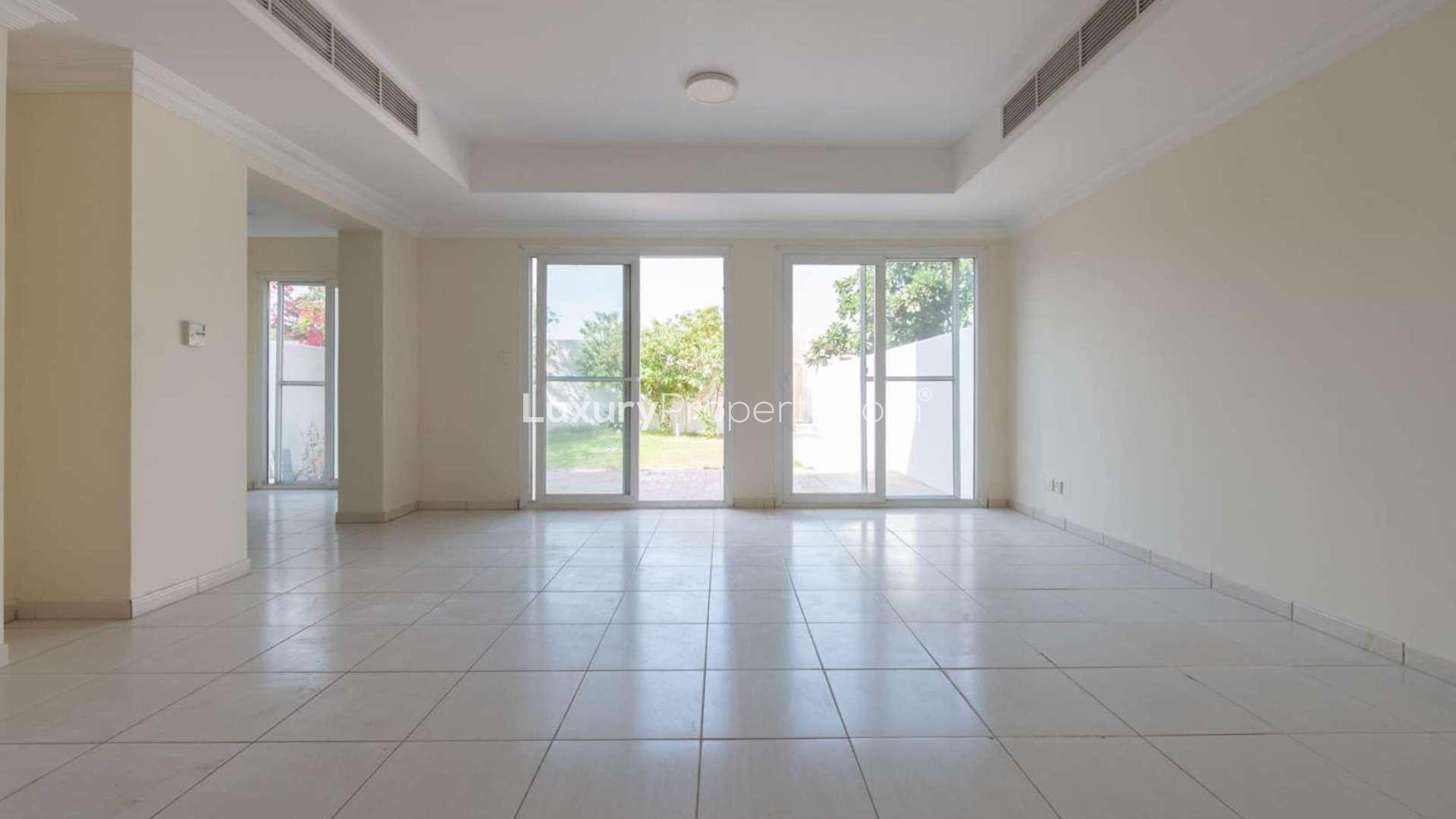 Spacious living room in 3M villa, Springs 15, with garden view through glass doors