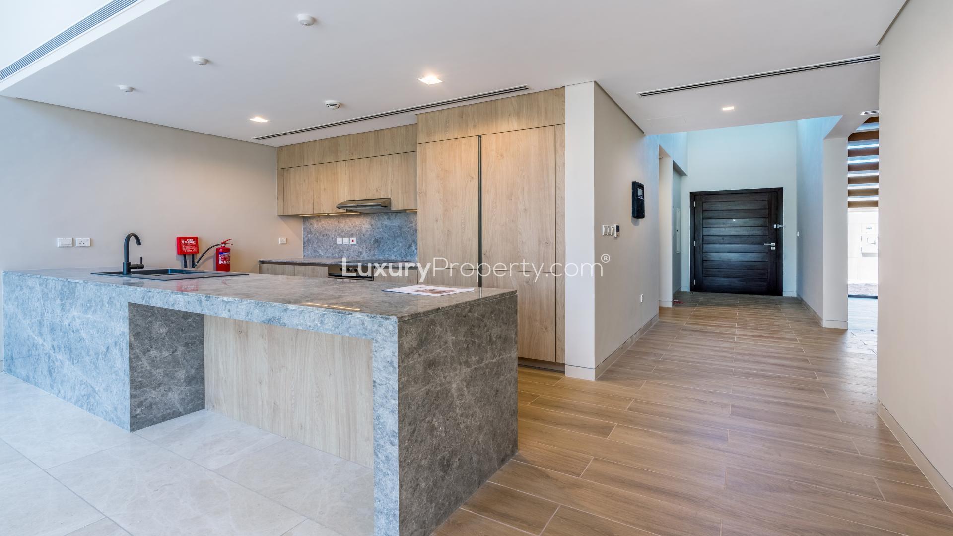 Balcony view from 3-bedroom villa in Villa Amalfi, Jumeirah Bay Island, overlooking city skyline