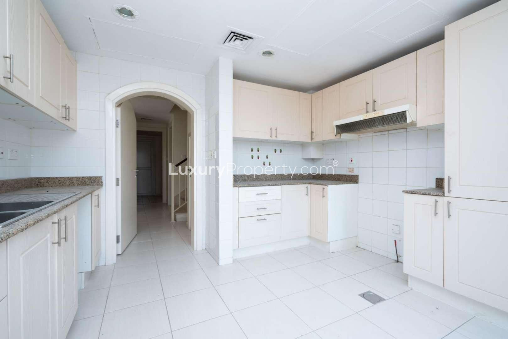 "Bright living room in 3-bedroom villa for rent, Springs 9, Emirates Living.",Bright kitchen in a spacious 3-bedroom villa for rent, Springs 9, Emirates Living