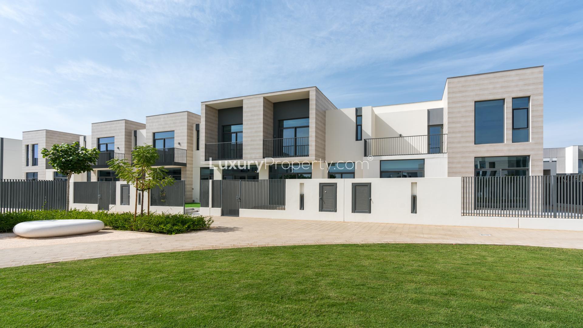 Modern kitchen and living area in Arabian Ranches 3 townhouse for rent