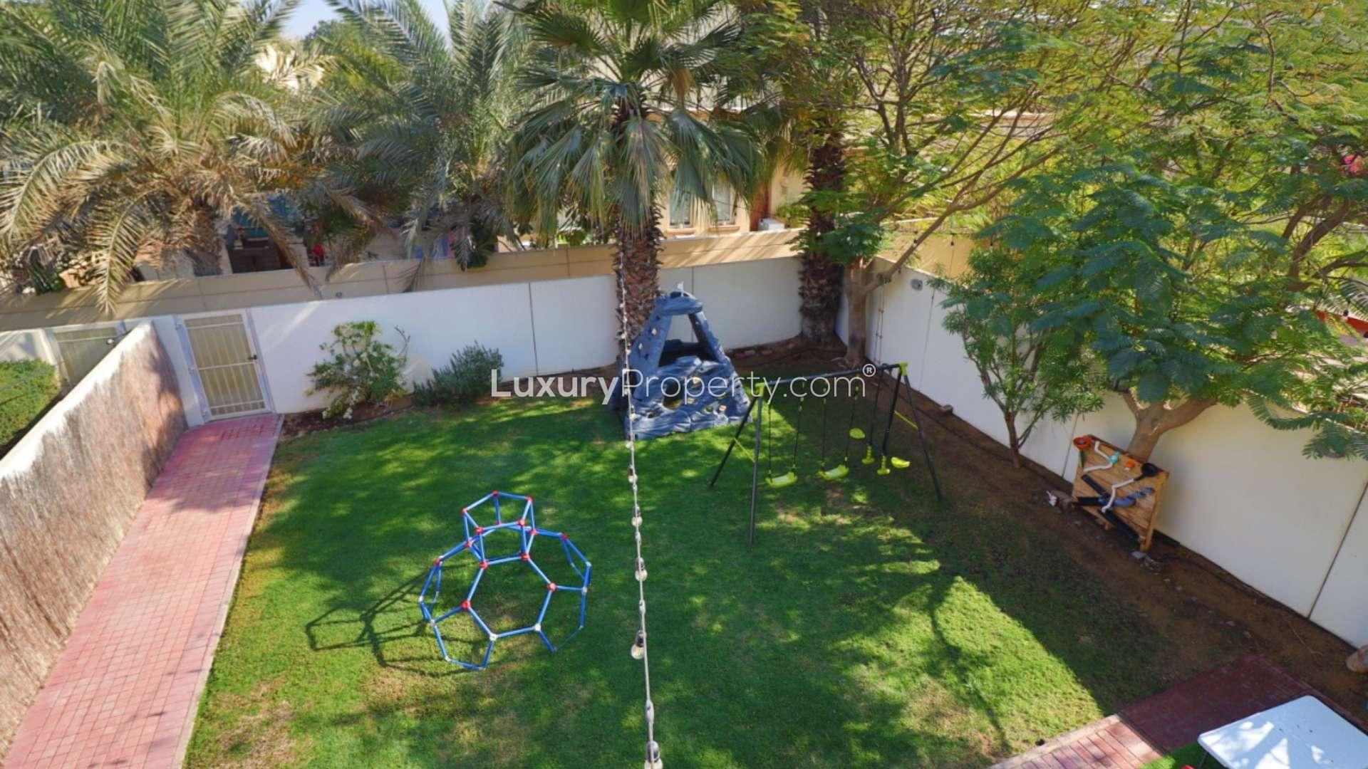 Modern kitchen in 3-bed corner villa, Springs 14, with sleek cabinets and mosaic backsplash