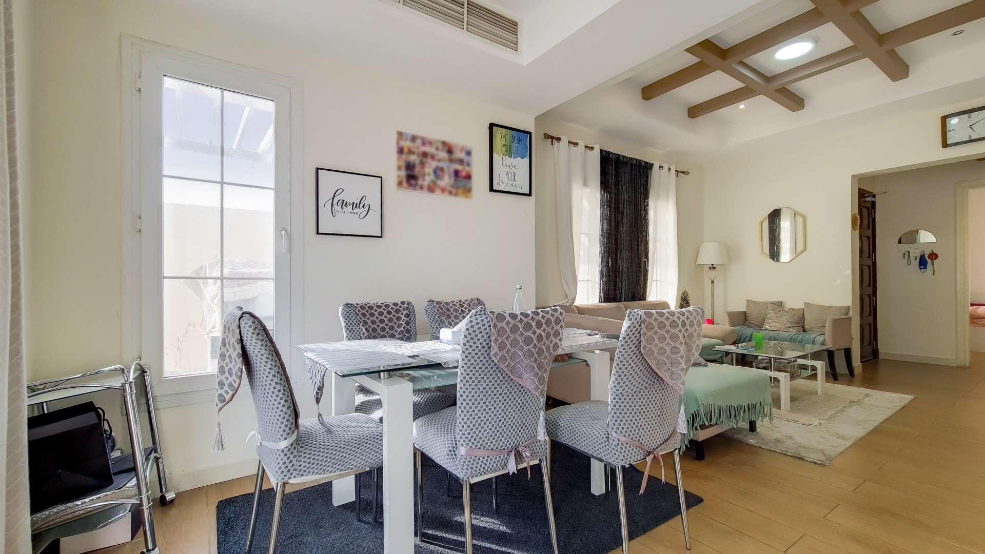 Living room in fully upgraded villa, Springs 7, featuring modern decor and natural light