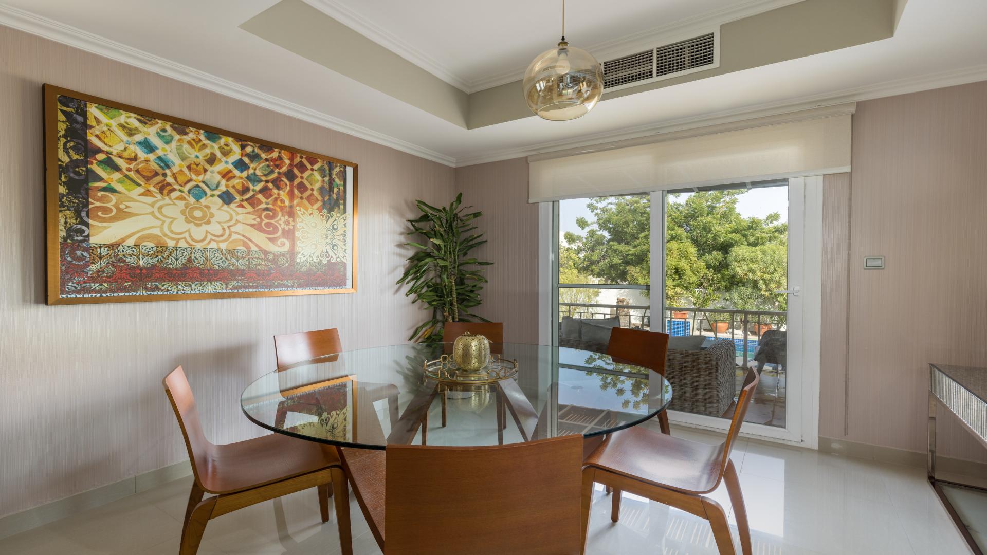 Fully furnished living room in upgraded villa, Springs 14, with modern decor and natural light