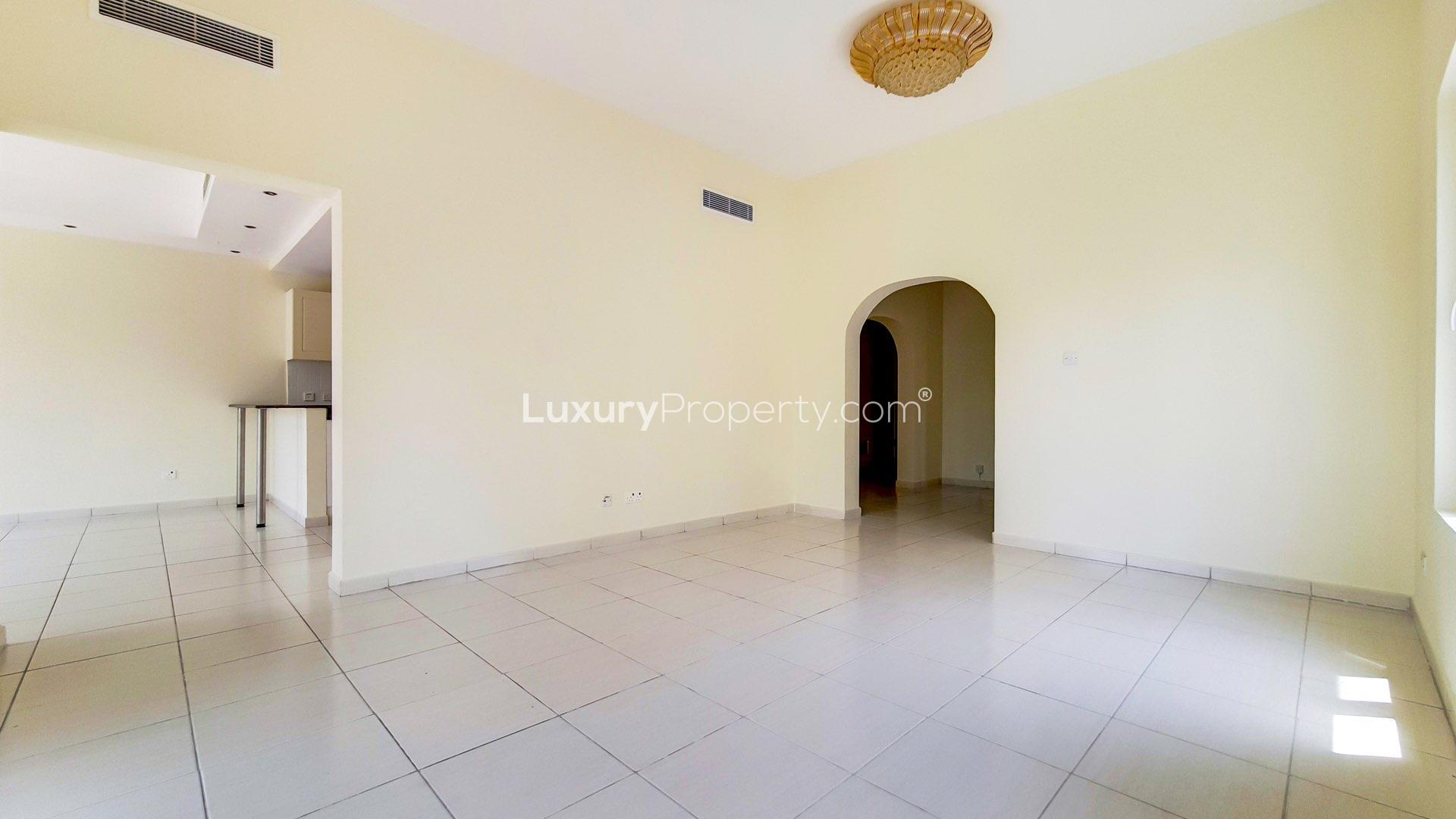 "Bright living area with garden view in Type 1E villa, The Springs, for rent.","Spacious living room in 3-bedroom villa for rent, The Springs, lake views, LP13949.","Modern kitchen in Type 1E villa at The Springs, available for rent, LP13949.",N/A,Empty room with tiled floor and windows in Type 1E Villa, The Springs