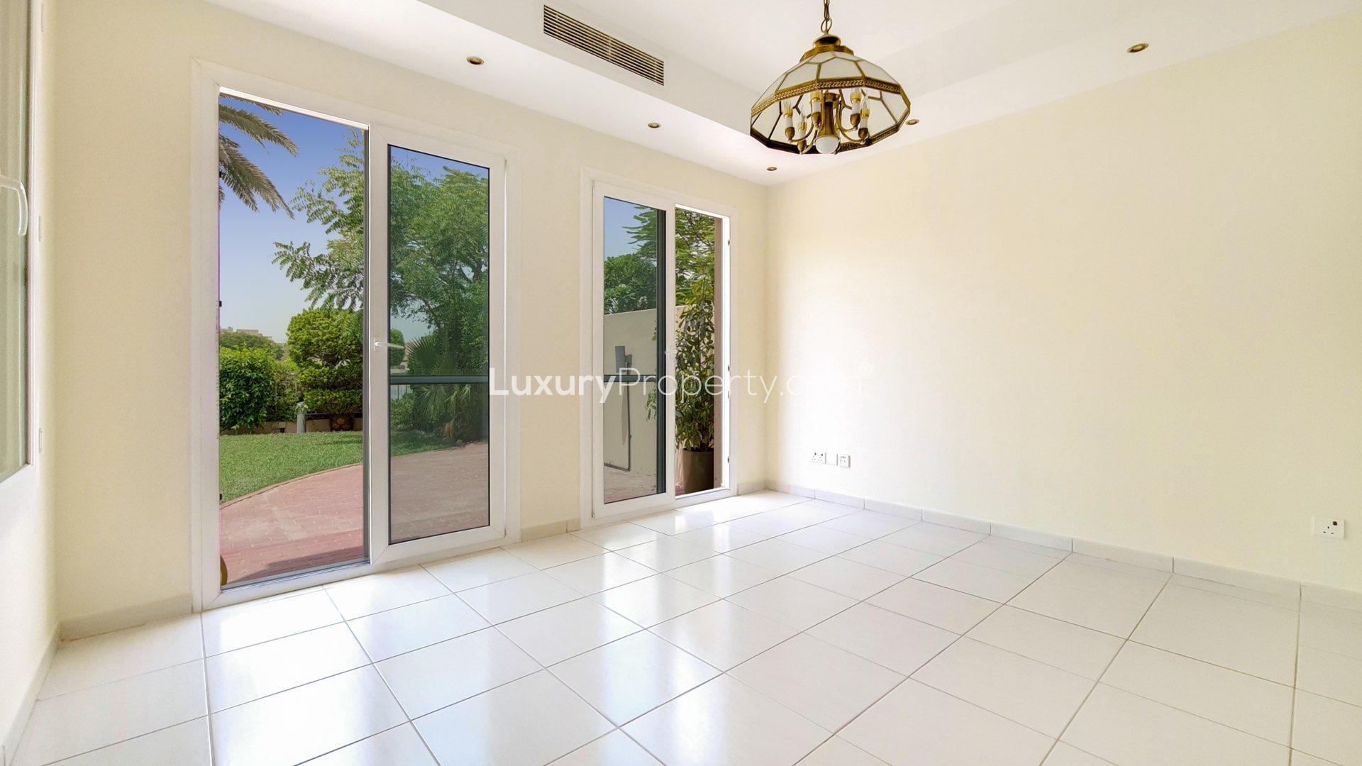 Sunny terrace with lake views at Type 1E villa in The Springs community