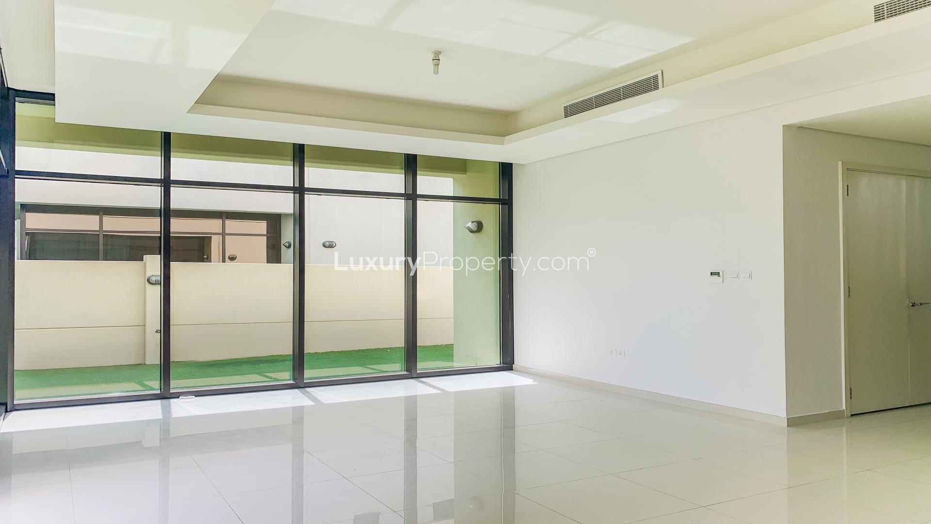 Modern villa interior with large glass doors in Damac Hills, Topanga, for rent