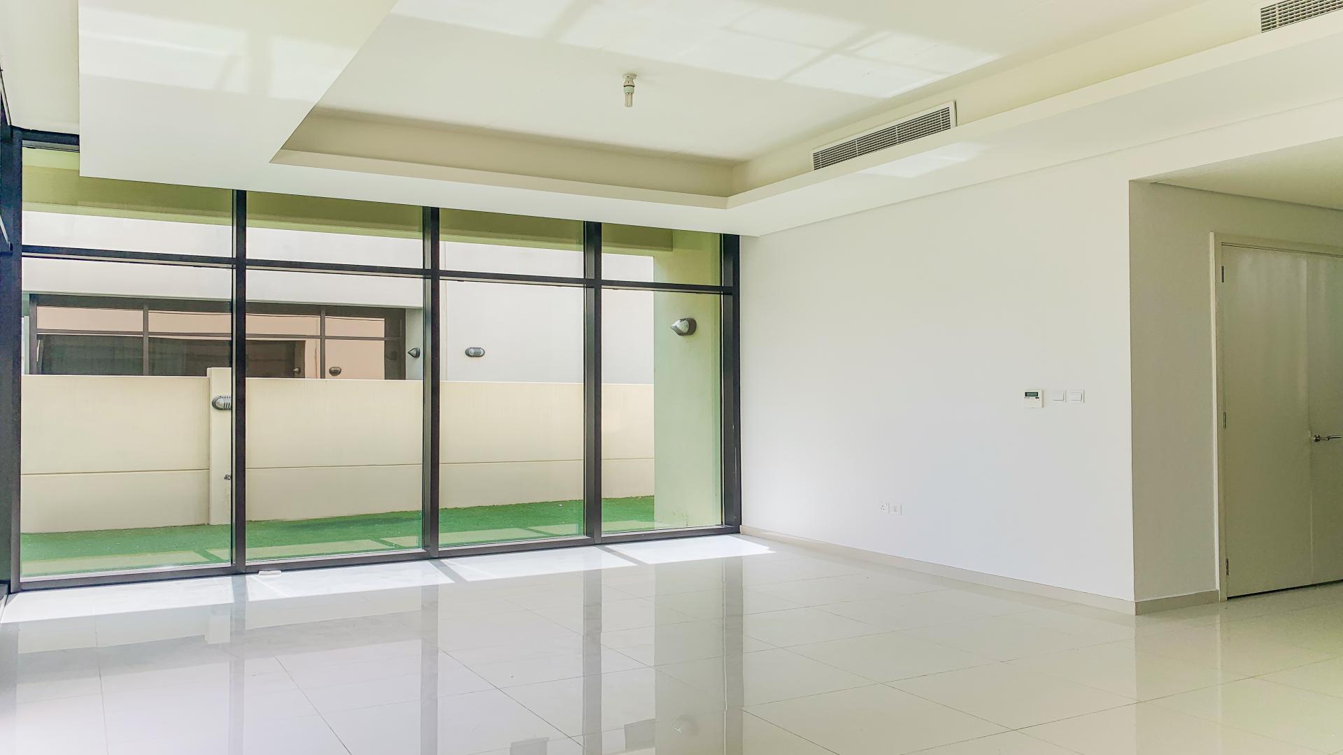 Modern villa interior with large glass doors in Damac Hills, Topanga, for rent