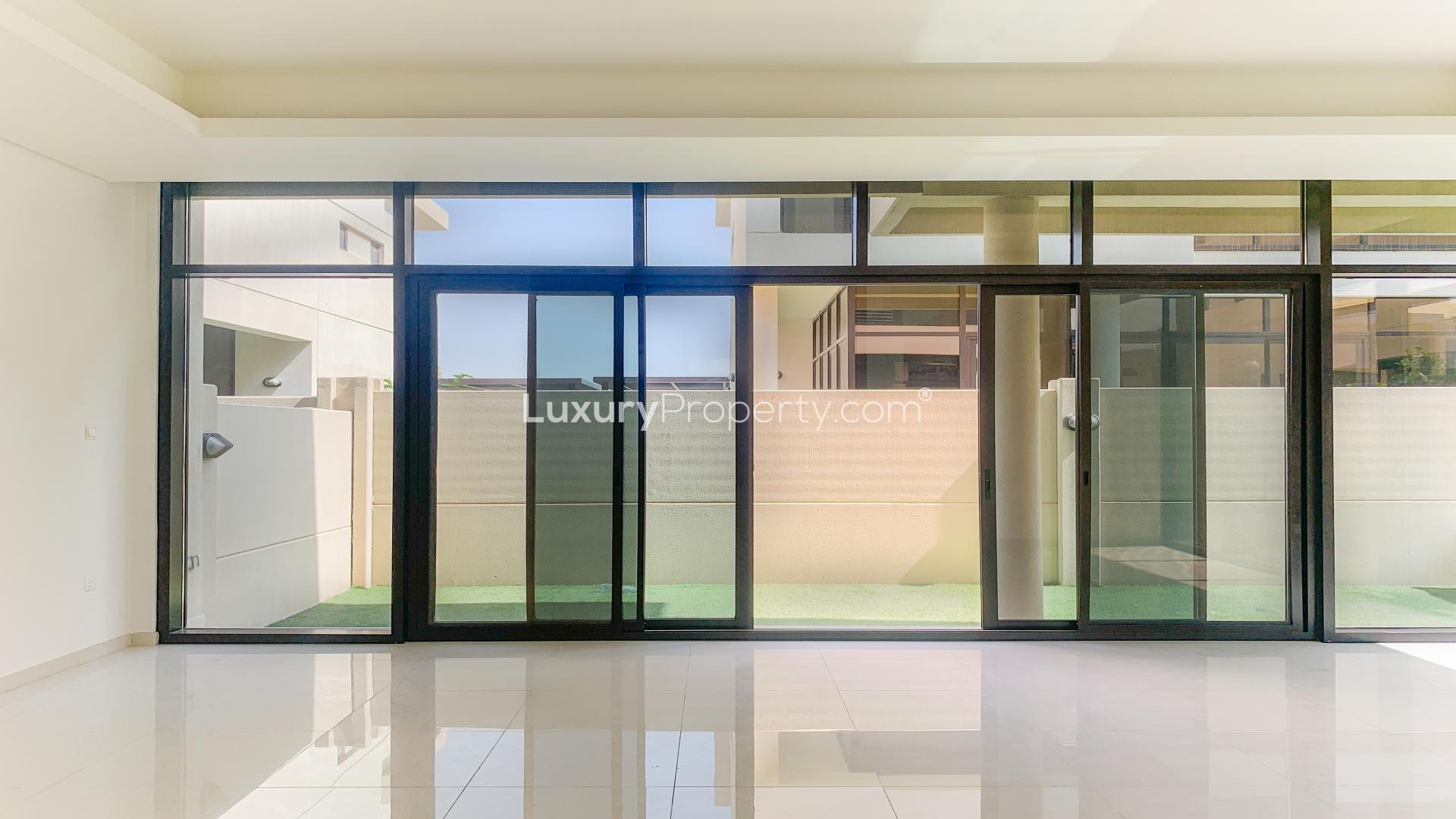 Modern villa balcony view in Damac Hills, Topanga community, showcasing lush greenery