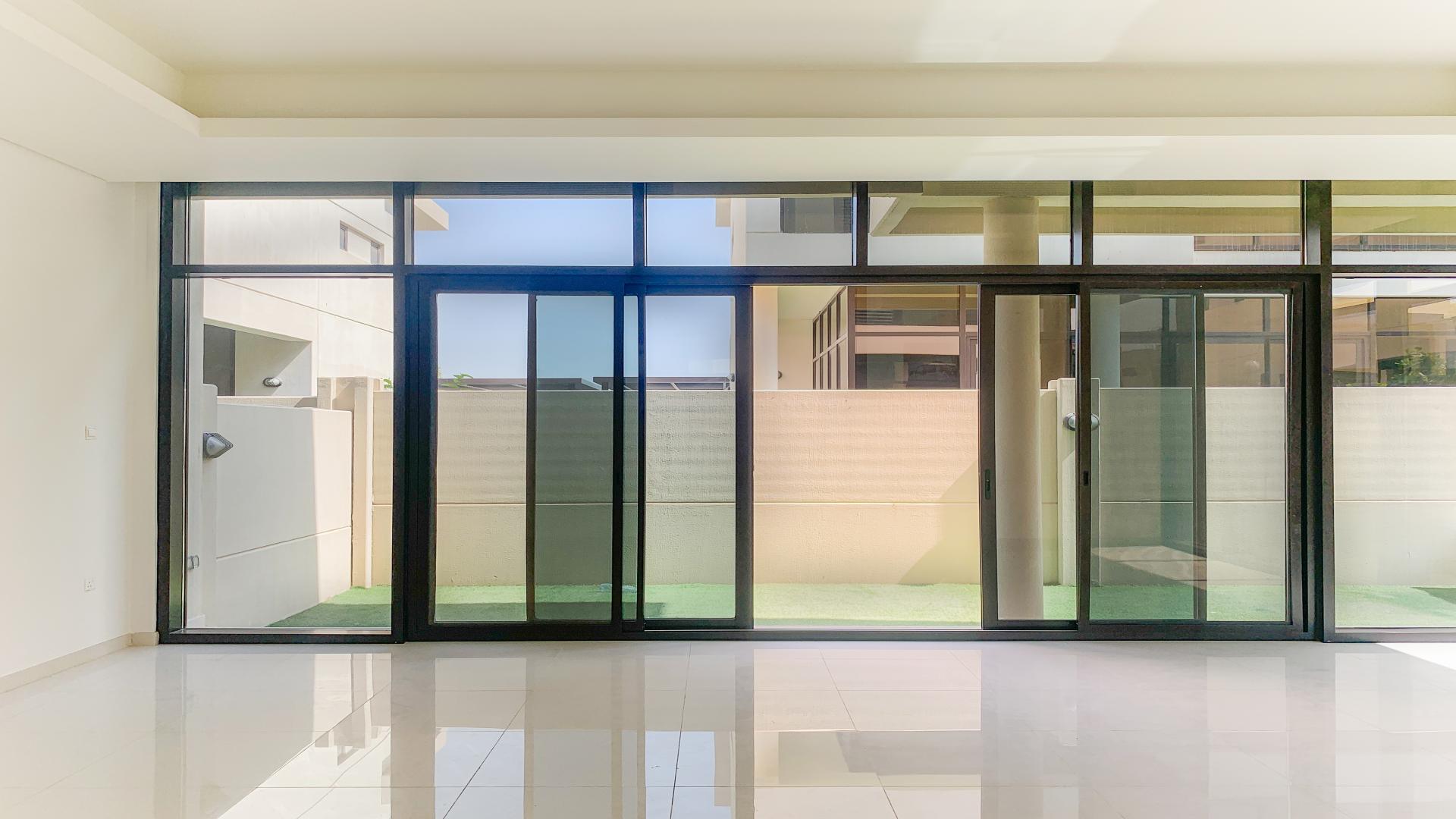 Modern villa balcony view in Damac Hills, Topanga community, showcasing lush greenery