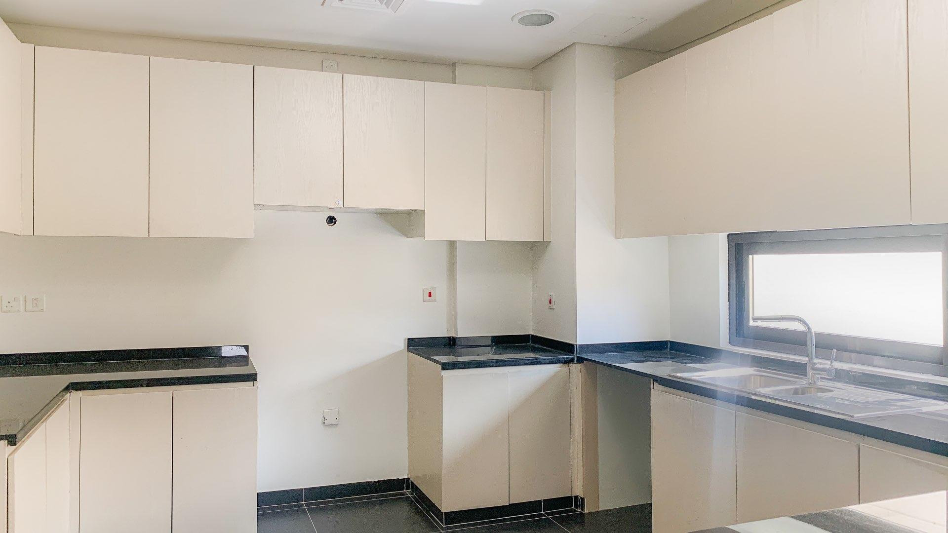 Modern villa interior with large windows in Damac Hills, Topanga community, available for rent